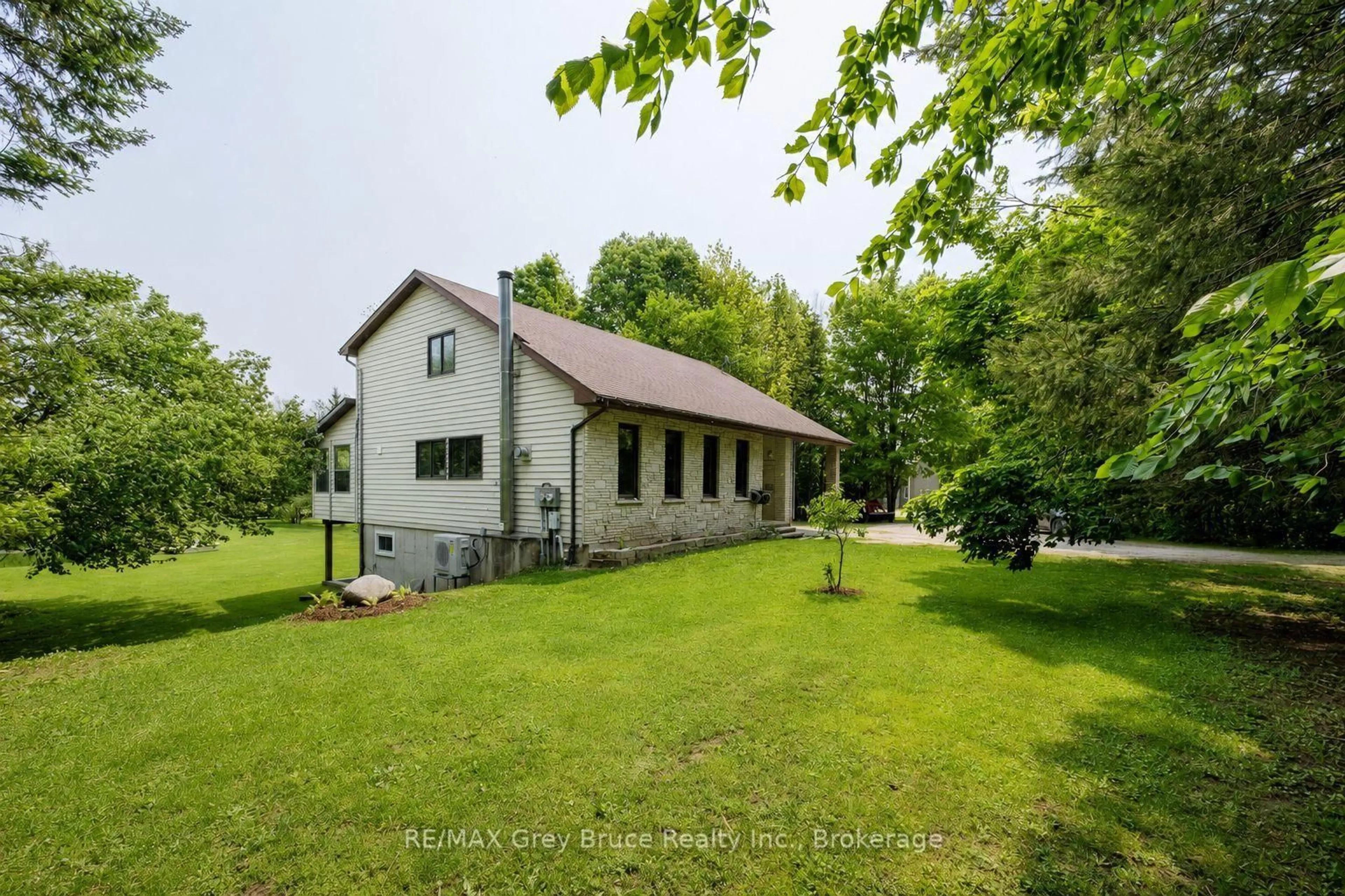 A pic from outside/outdoor area/front of a property/back of a property/a pic from drone, unknown for 1033 Bruce Road 9, South Bruce Peninsula Ontario N0H 2T0
