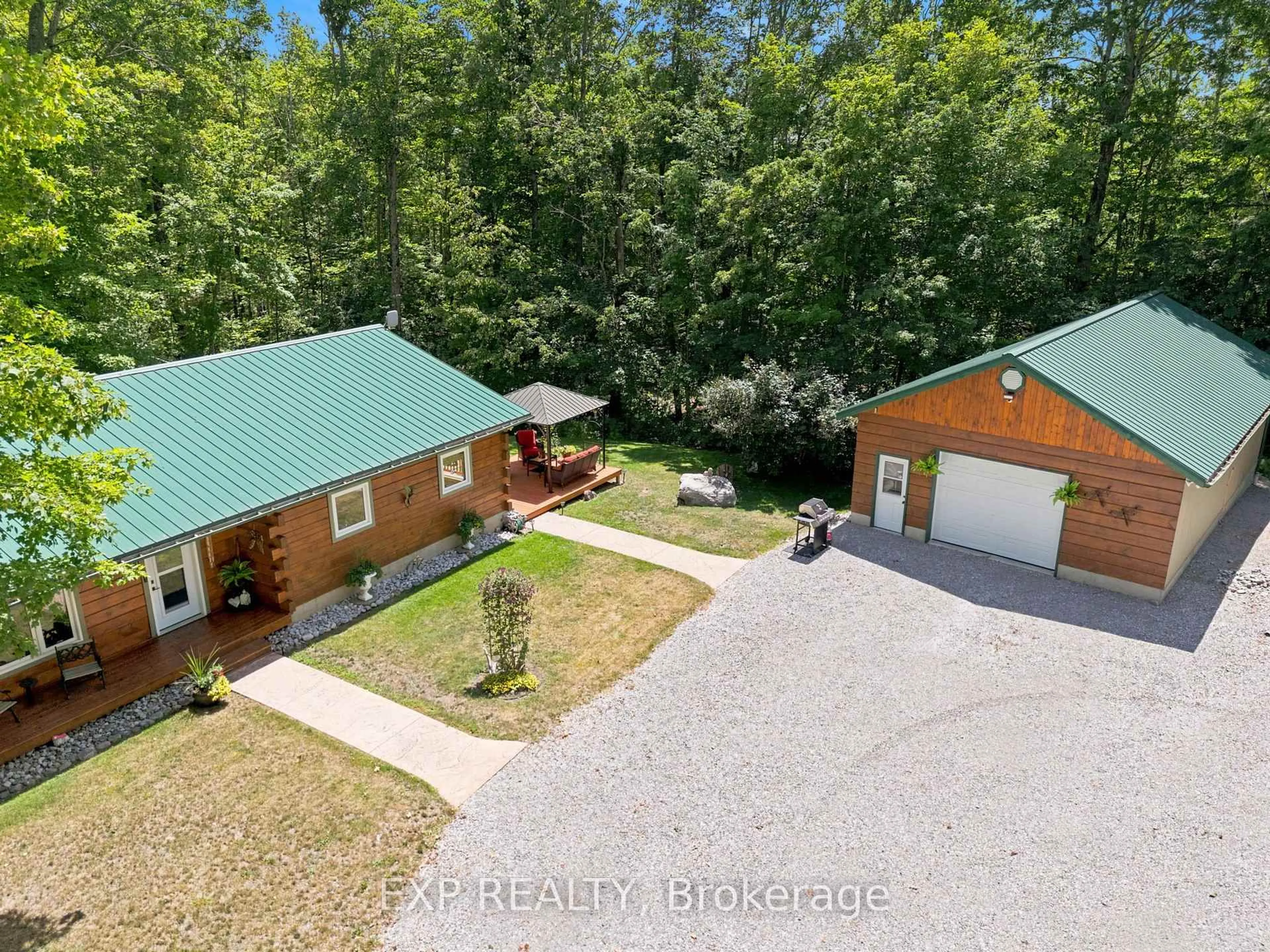 A pic from outside/outdoor area/front of a property/back of a property/a pic from drone, forest/trees view for 944 County Road 8 Rd, Kawartha Lakes Ontario K0M 1N0