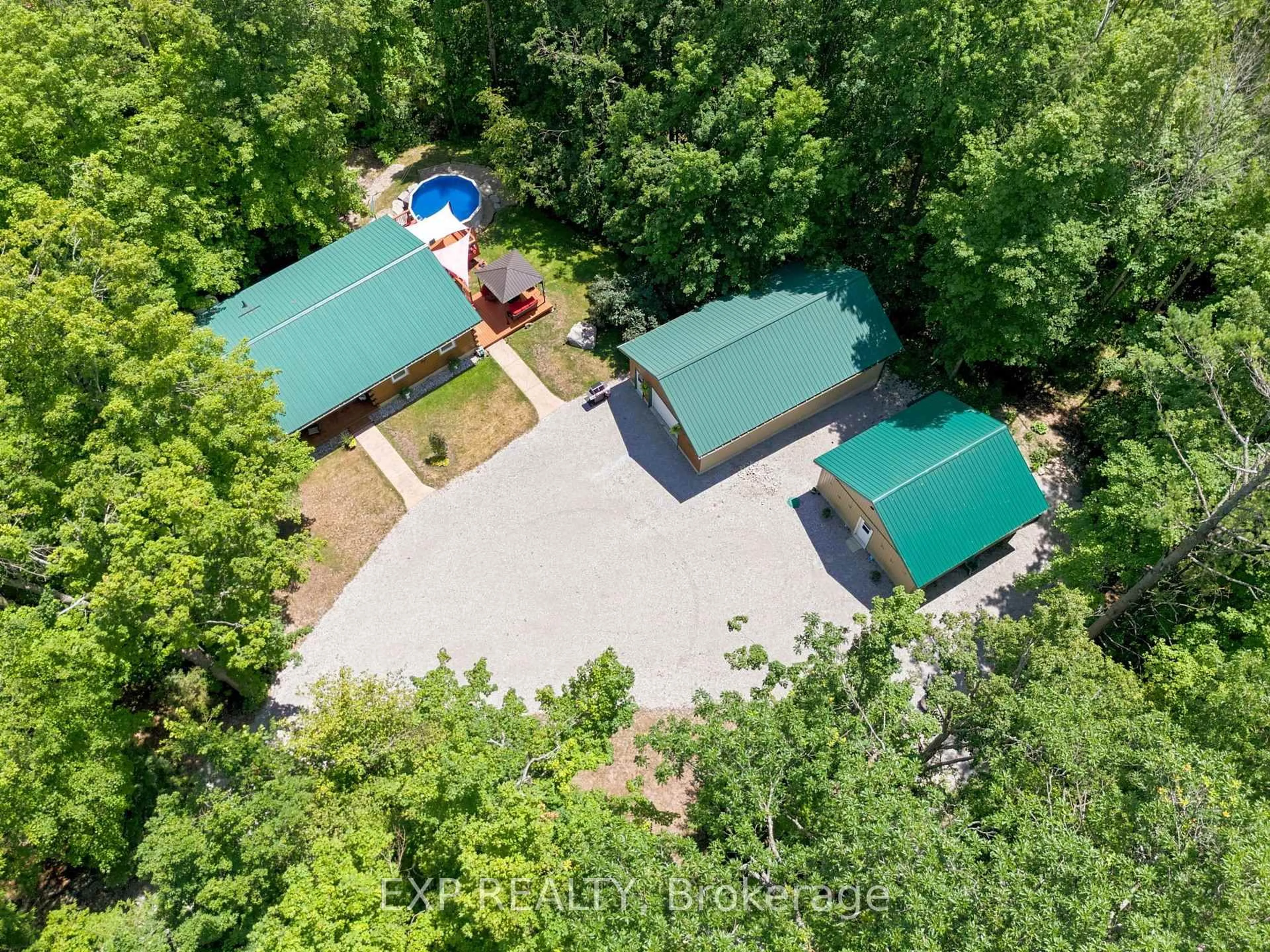 A pic from outside/outdoor area/front of a property/back of a property/a pic from drone, forest/trees view for 944 County Road 8 Rd, Kawartha Lakes Ontario K0M 1N0