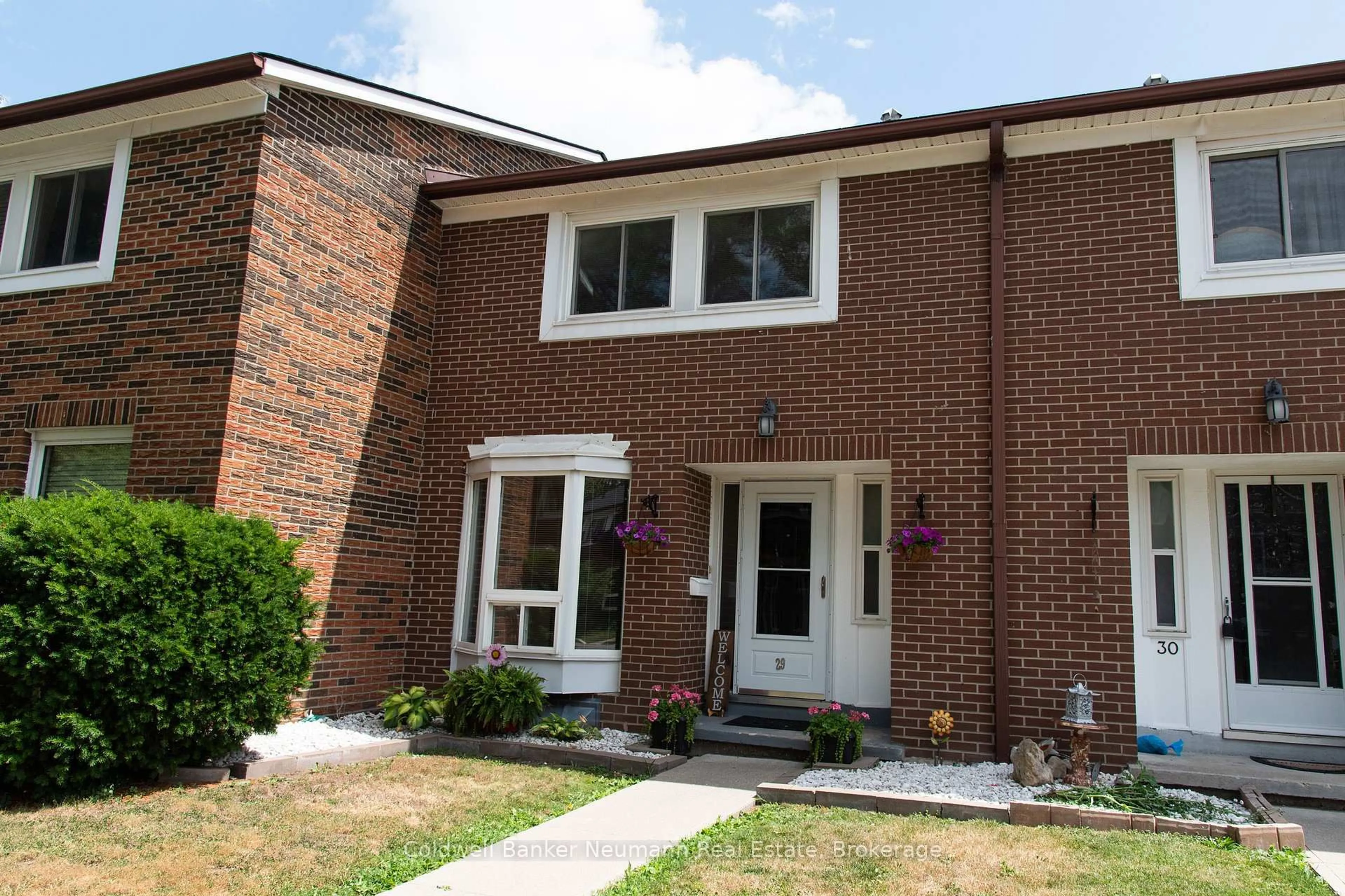Home with brick exterior material, street for 121 Bagot St #29, Guelph Ontario N1H 5T8