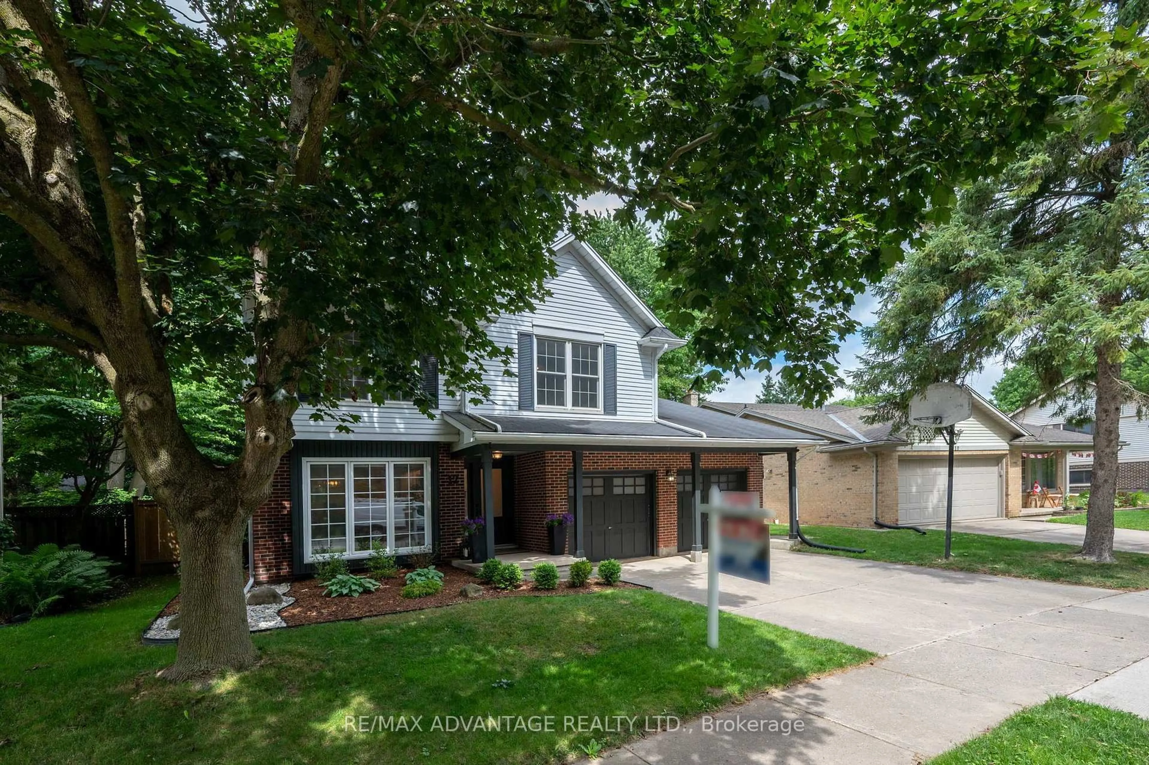 Home with brick exterior material, street for 12 Spencer Cres, London North Ontario N5X 2K6