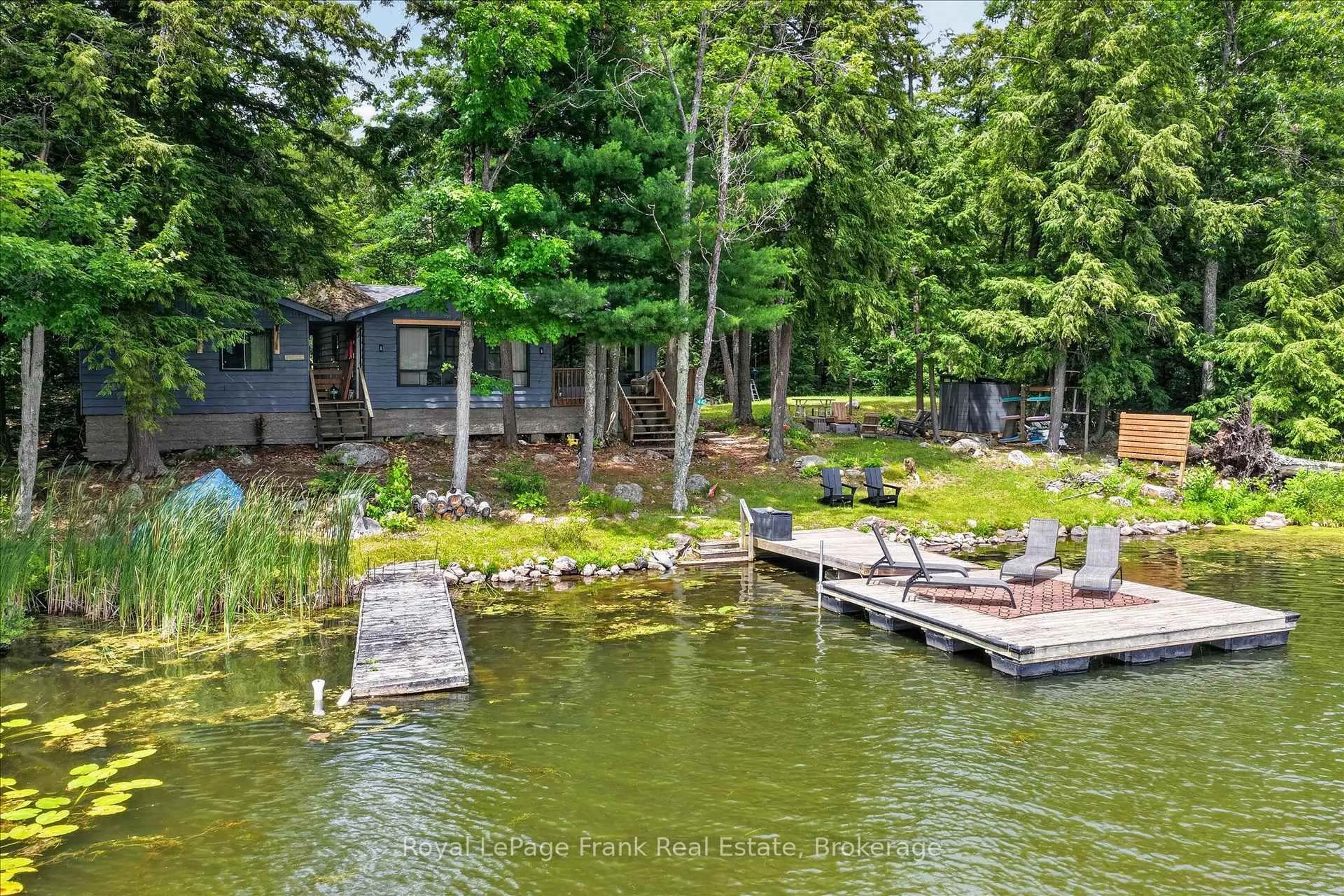 A pic from outside/outdoor area/front of a property/back of a property/a pic from drone, water/lake/river/ocean view for 442 Island 7 Stoney Lake, Douro-Dummer Ontario K0L 2H0
