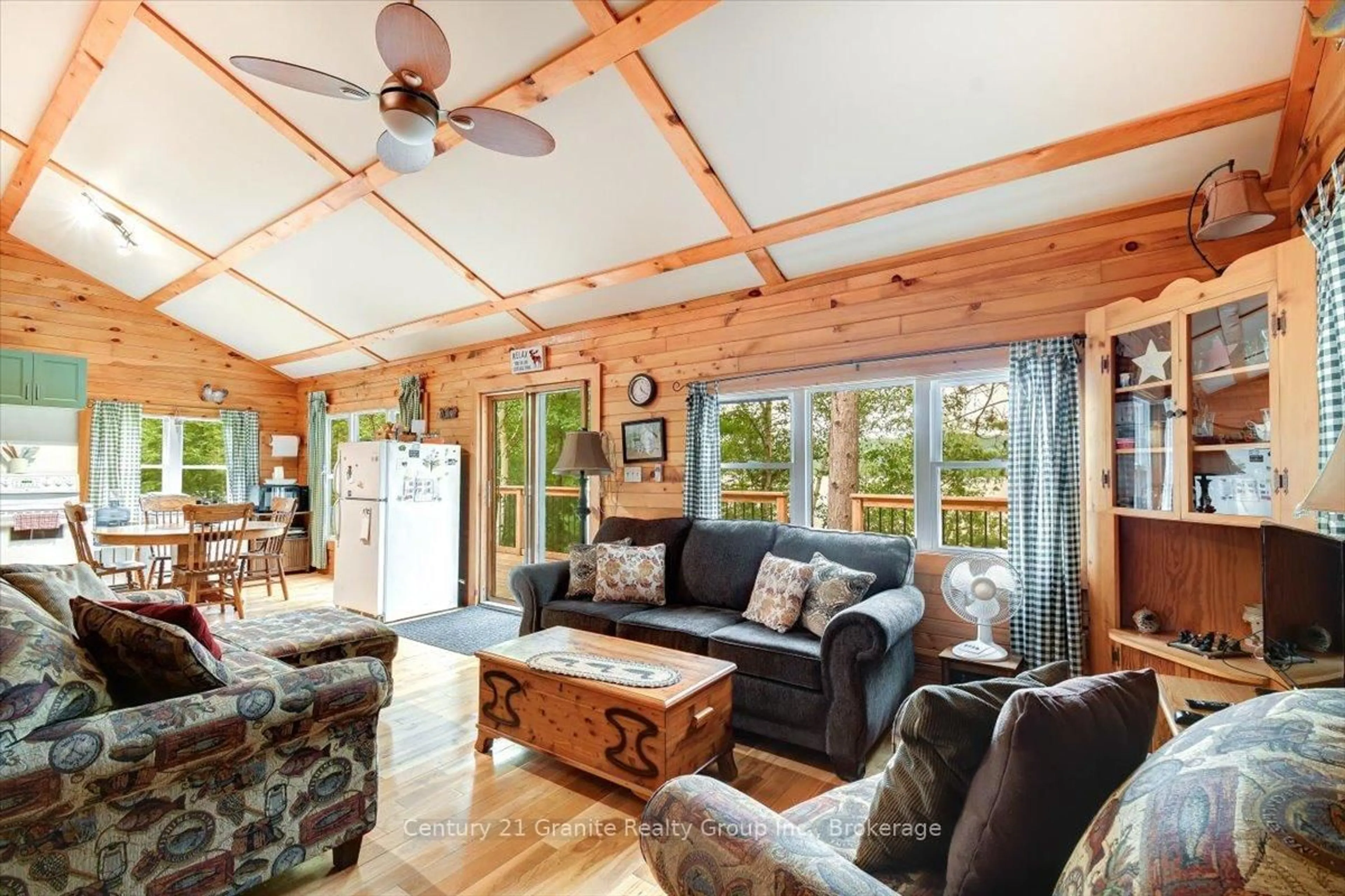 Living room with furniture, wood/laminate floor for 91 Ups & Downs Lane, South Algonquin Ontario K0L 2K0