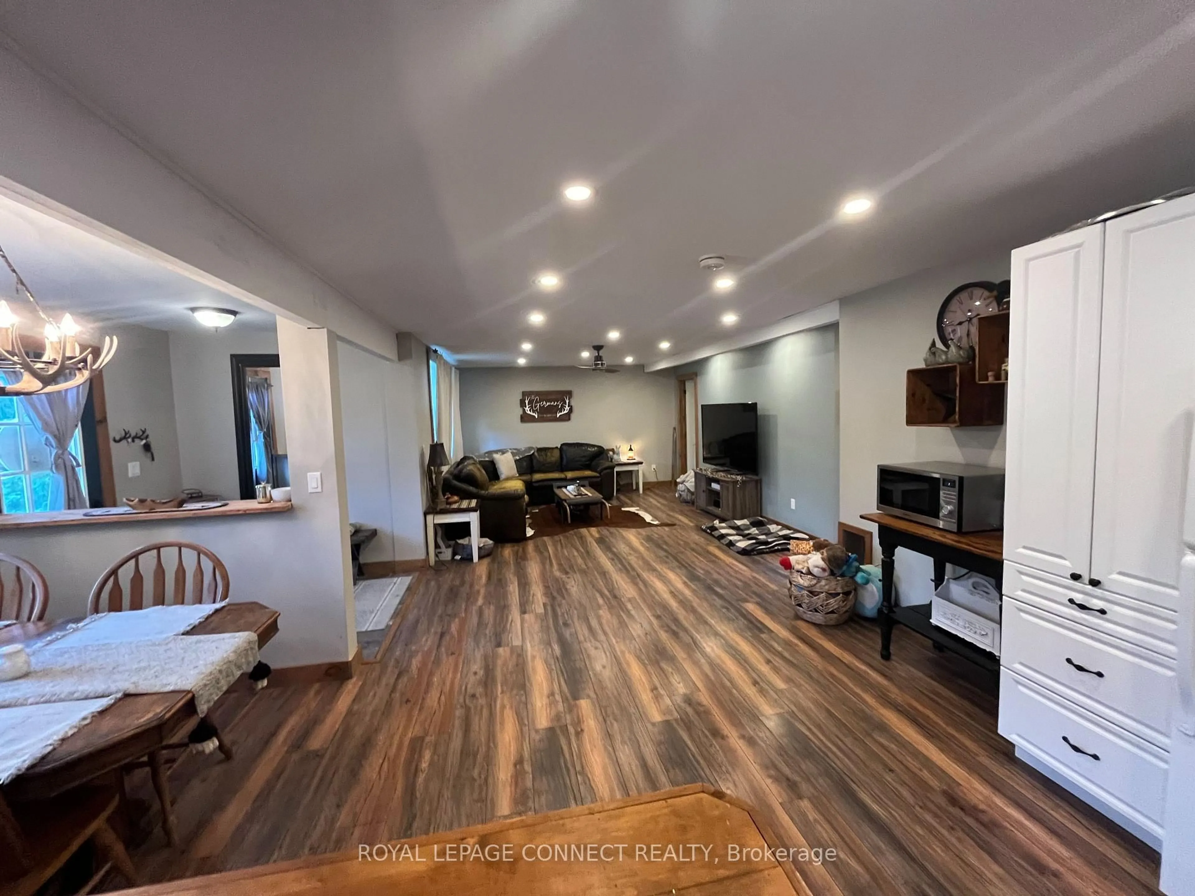 Living room with furniture, wood/laminate floor for 190 Pontypool Rd, Kawartha Lakes Ontario L0A 1K0