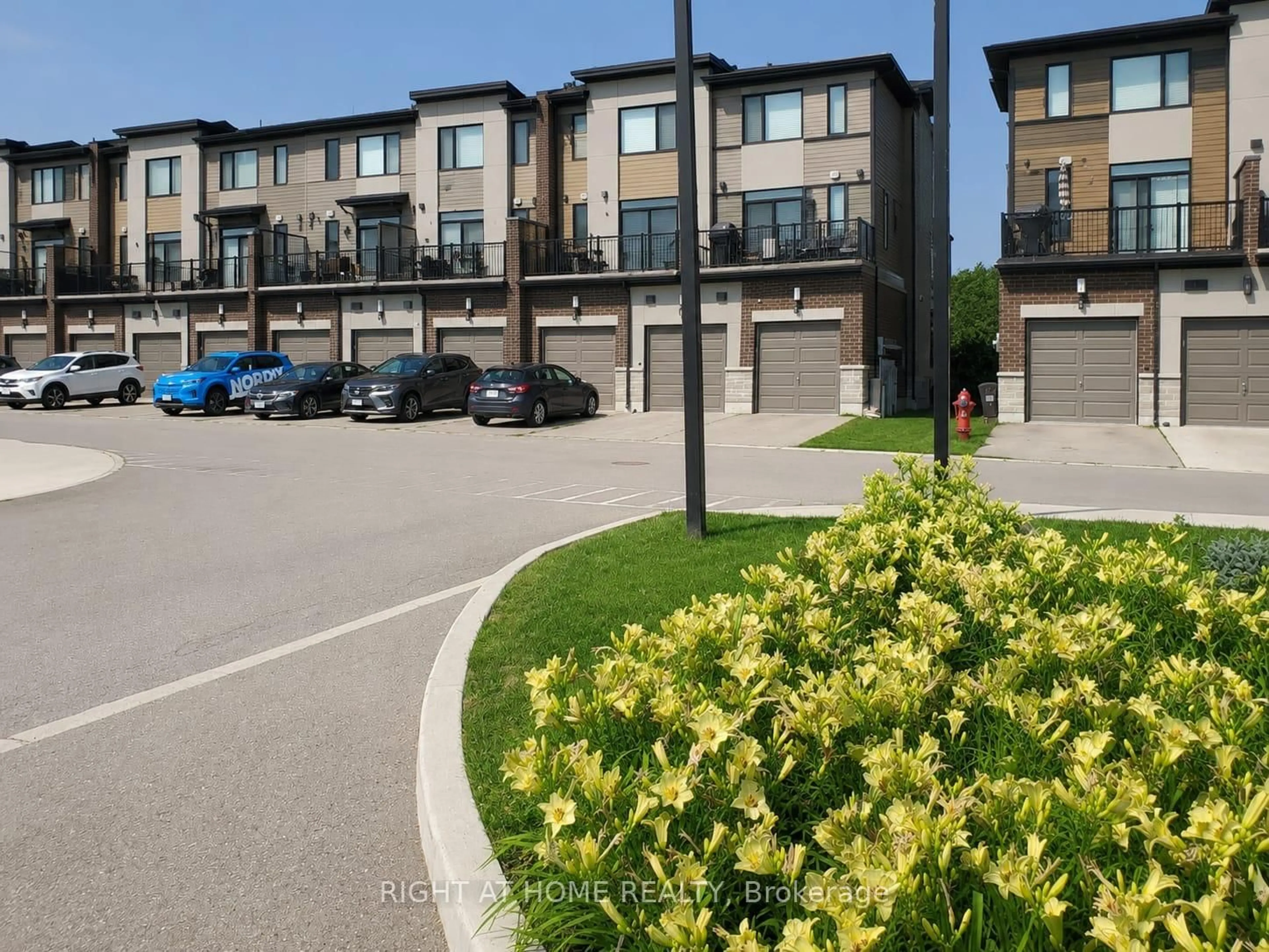 A pic from outside/outdoor area/front of a property/back of a property/a pic from drone, street for 590 North Service Rd #15, Hamilton Ontario L8E 0K5