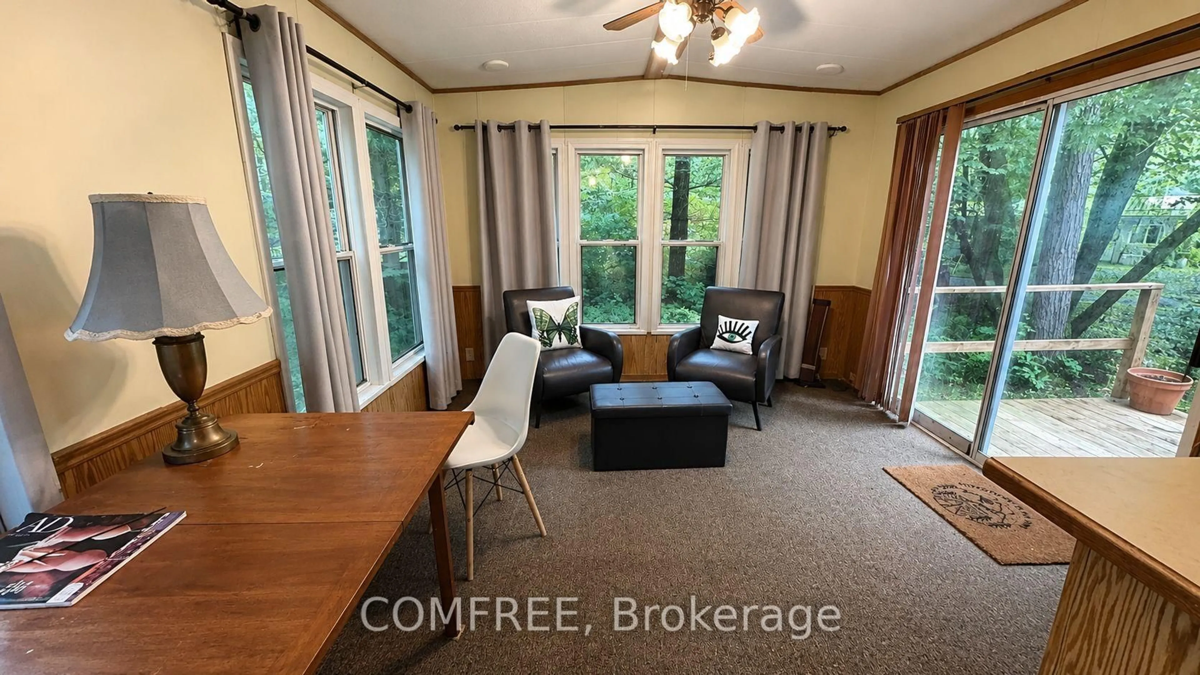 Living room with furniture, wood/laminate floor for 334 Rattlesnake Rd #14, Haldimand Ontario N0A 1K0