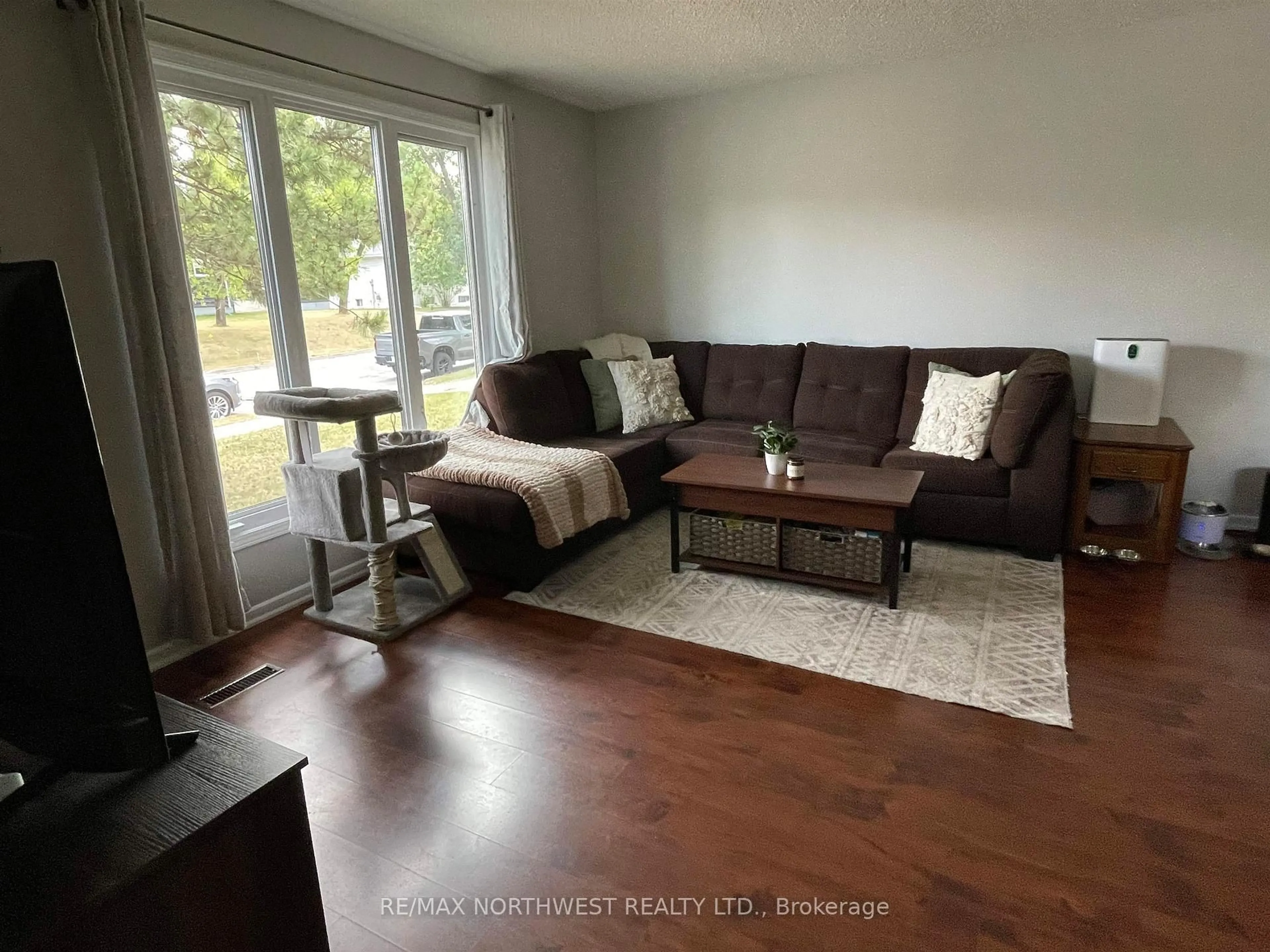 Living room with furniture, wood/laminate floor for 48 Thunder Drive, Dryden Ontario P8N 3C4