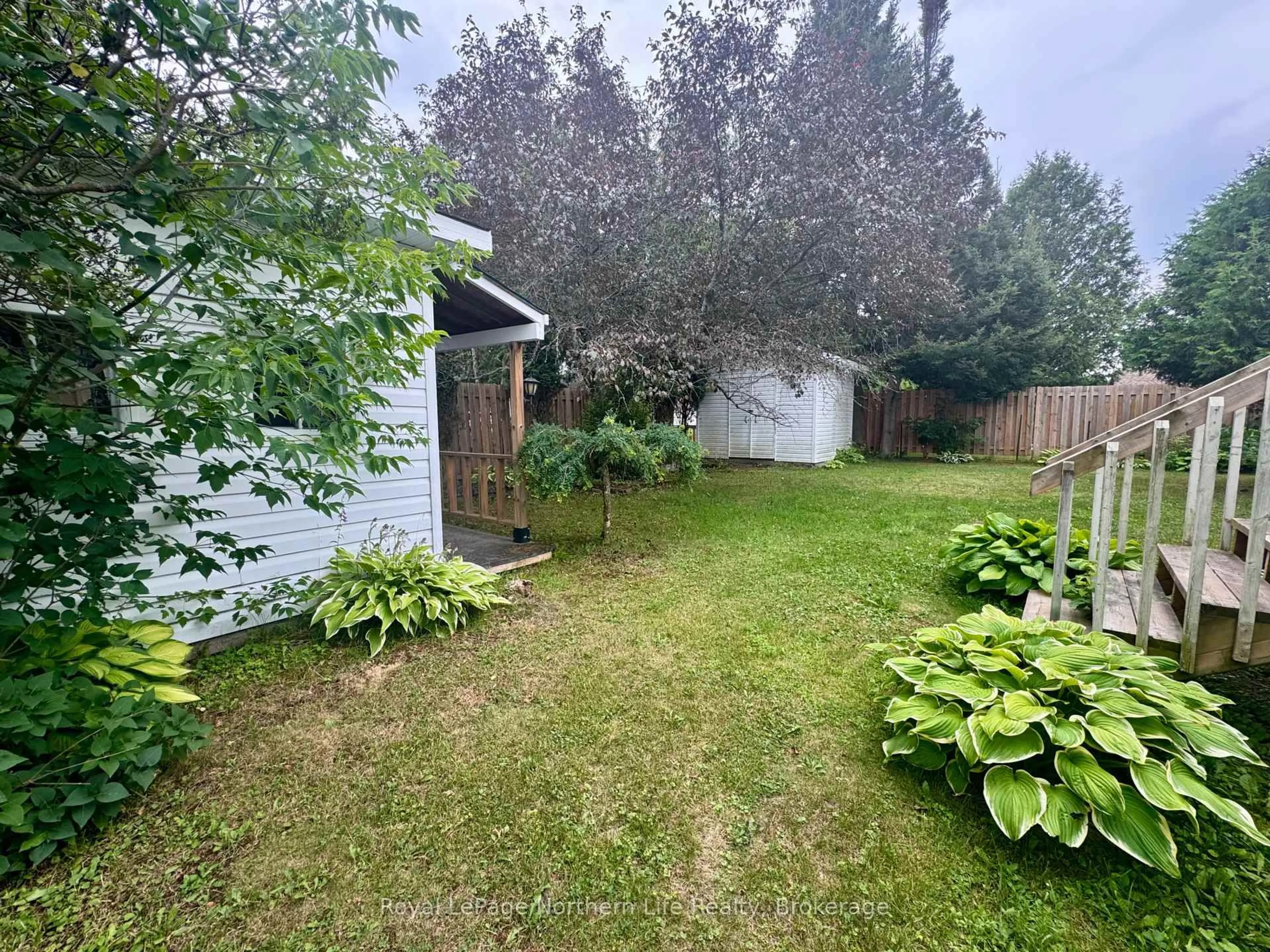 A pic from outside/outdoor area/front of a property/back of a property/a pic from drone, forest/trees view for 38 Big Bend Ave, Powassan Ontario P0H 1Z0