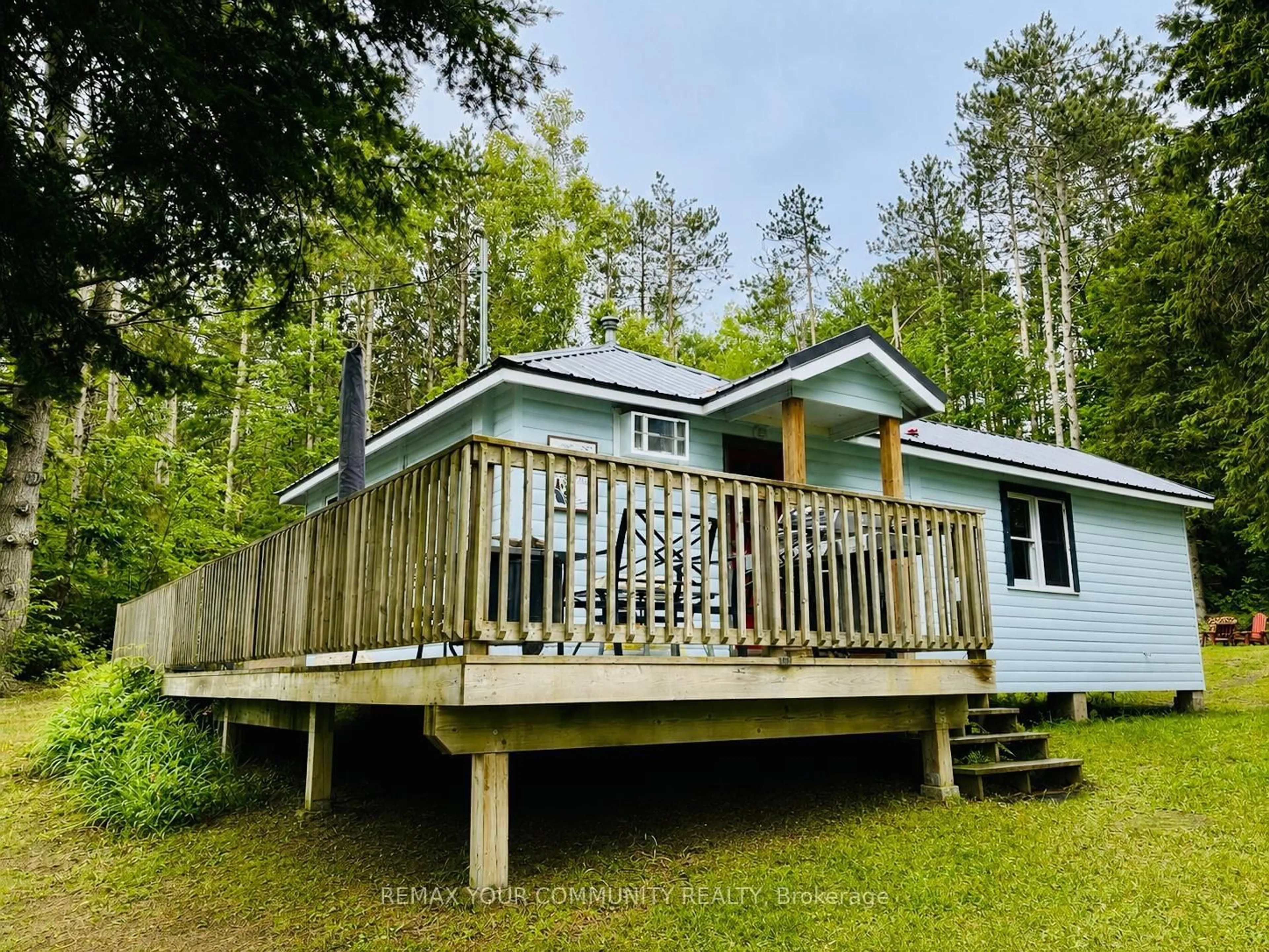 A pic from outside/outdoor area/front of a property/back of a property/a pic from drone, unknown for 42 Fire Route 342, Trent Lakes Ontario K0M 1R0