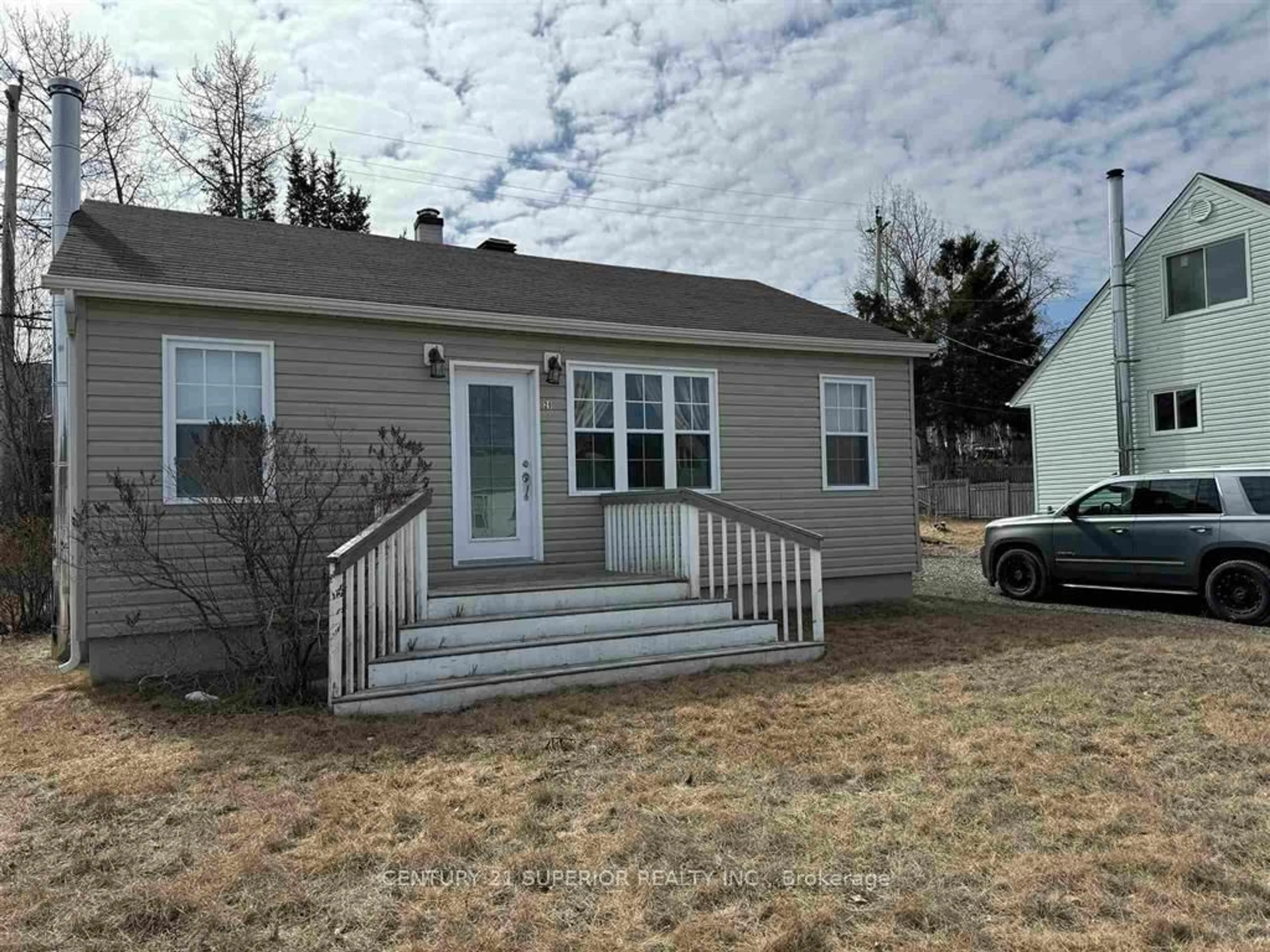 Home with vinyl exterior material, street for 20 Neebig Ave, Manitouwadge Ontario P0T 2C0
