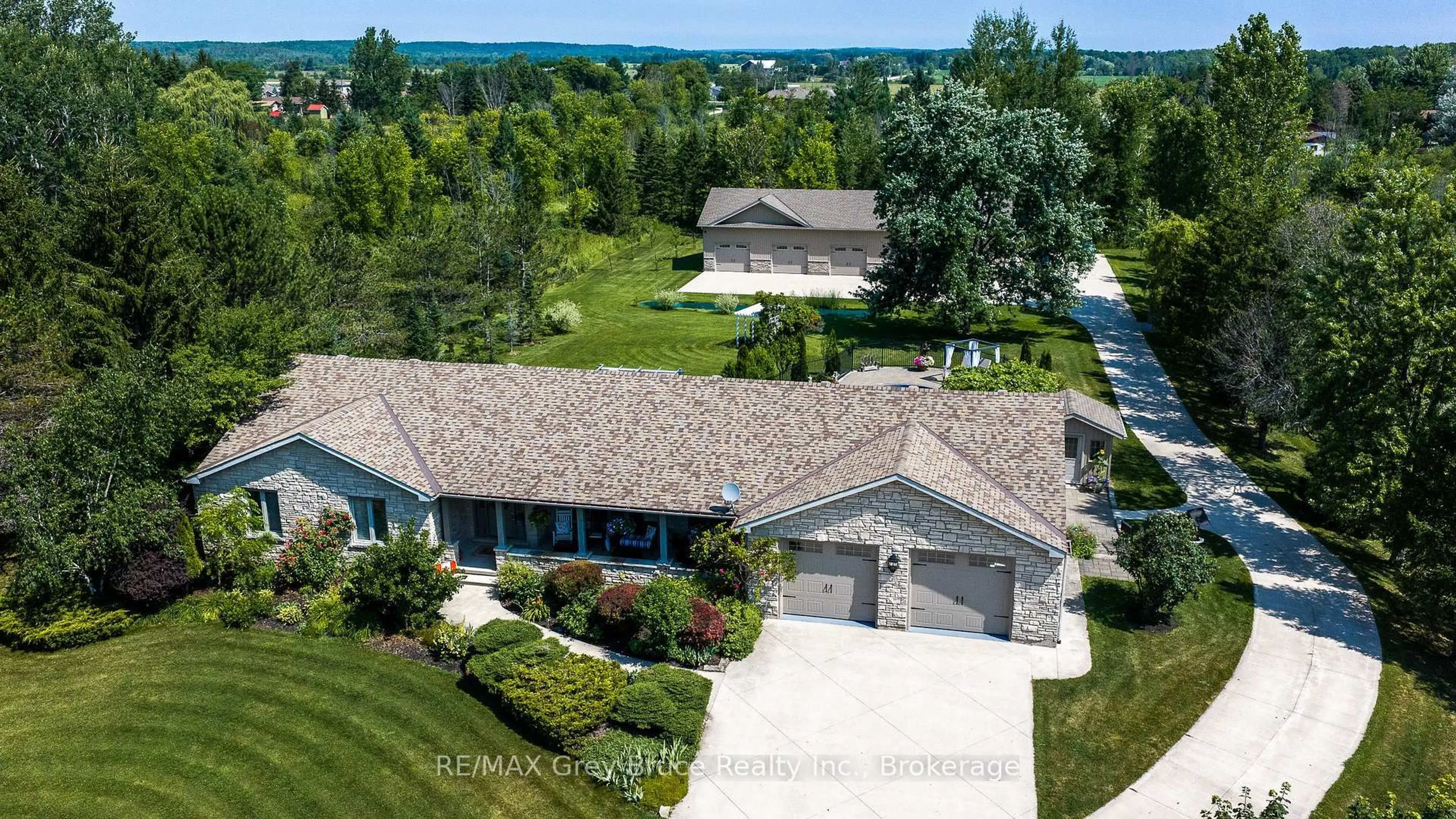 A pic from outside/outdoor area/front of a property/back of a property/a pic from drone, water/lake/river/ocean view for 913 27th St, Georgian Bluffs Ontario N4K 5N4