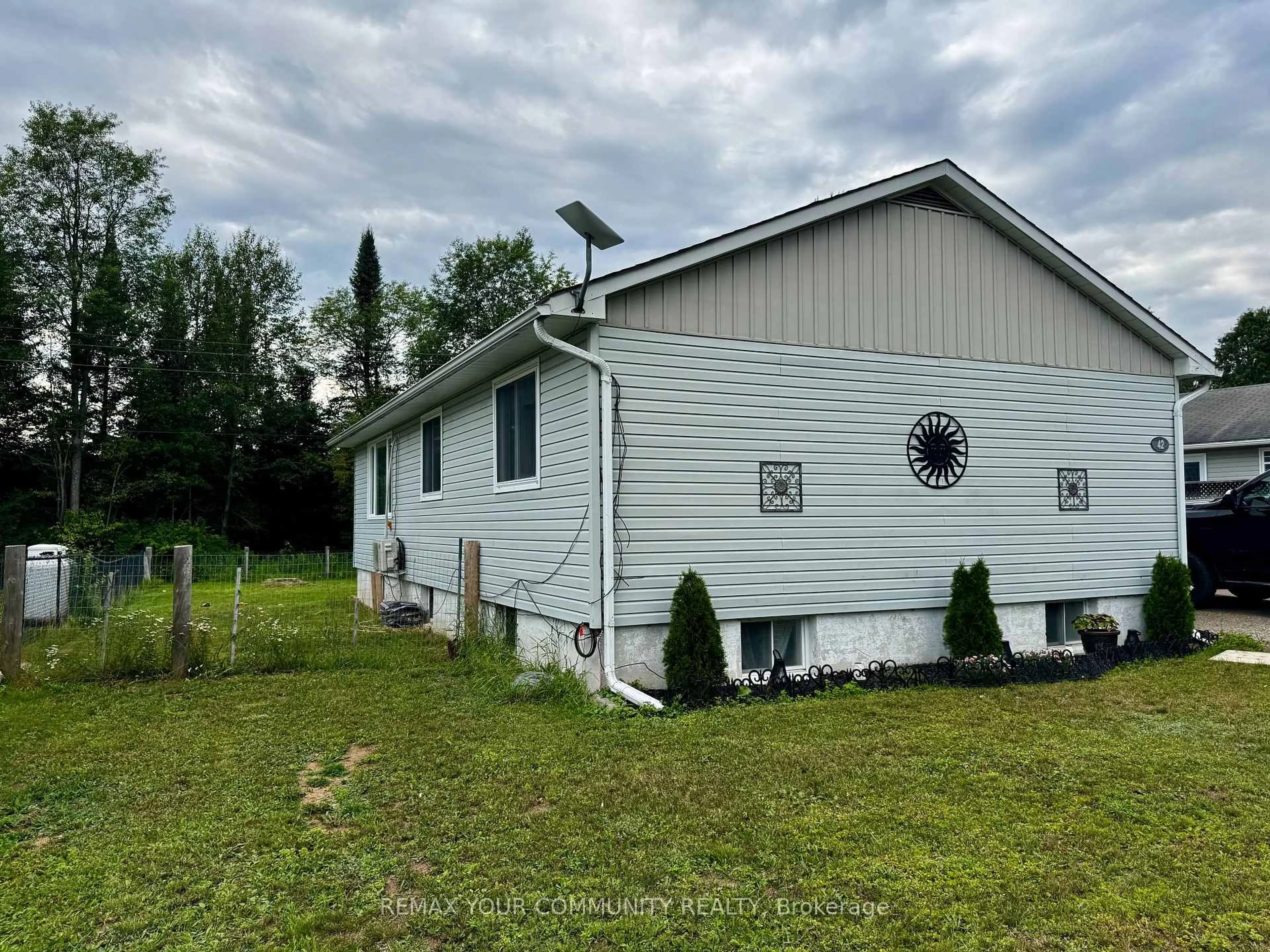 Home with vinyl exterior material, building for 42 Sprucedale St, Highlands East Ontario K0L 1M0