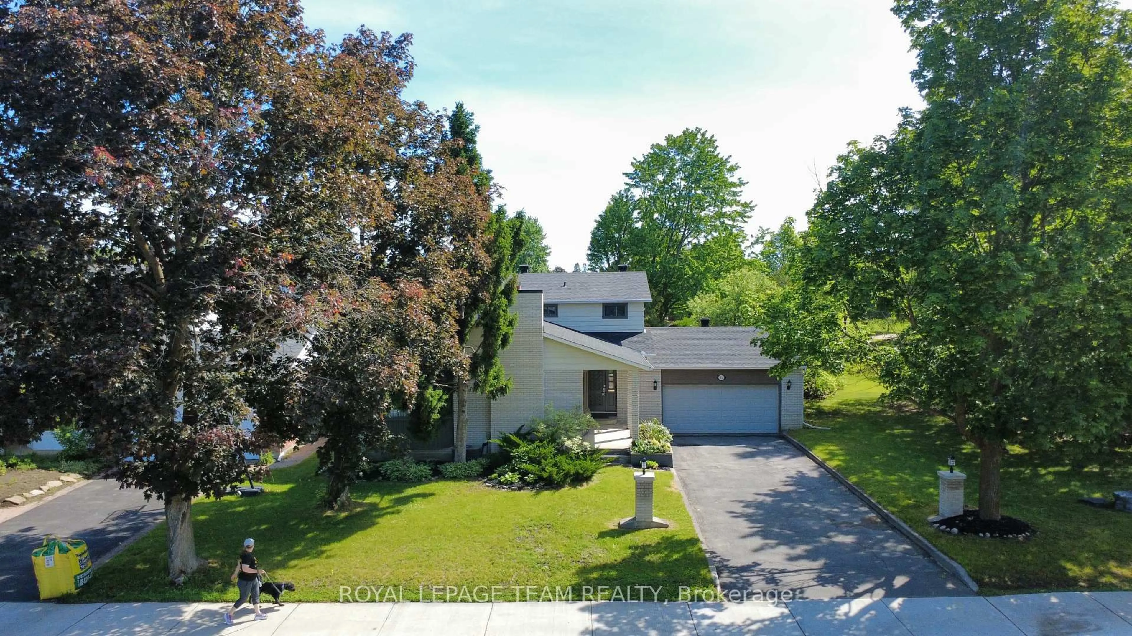 A pic from outside/outdoor area/front of a property/back of a property/a pic from drone, street for 61 Amberwood Cres, Ottawa Ontario K2E 7C2