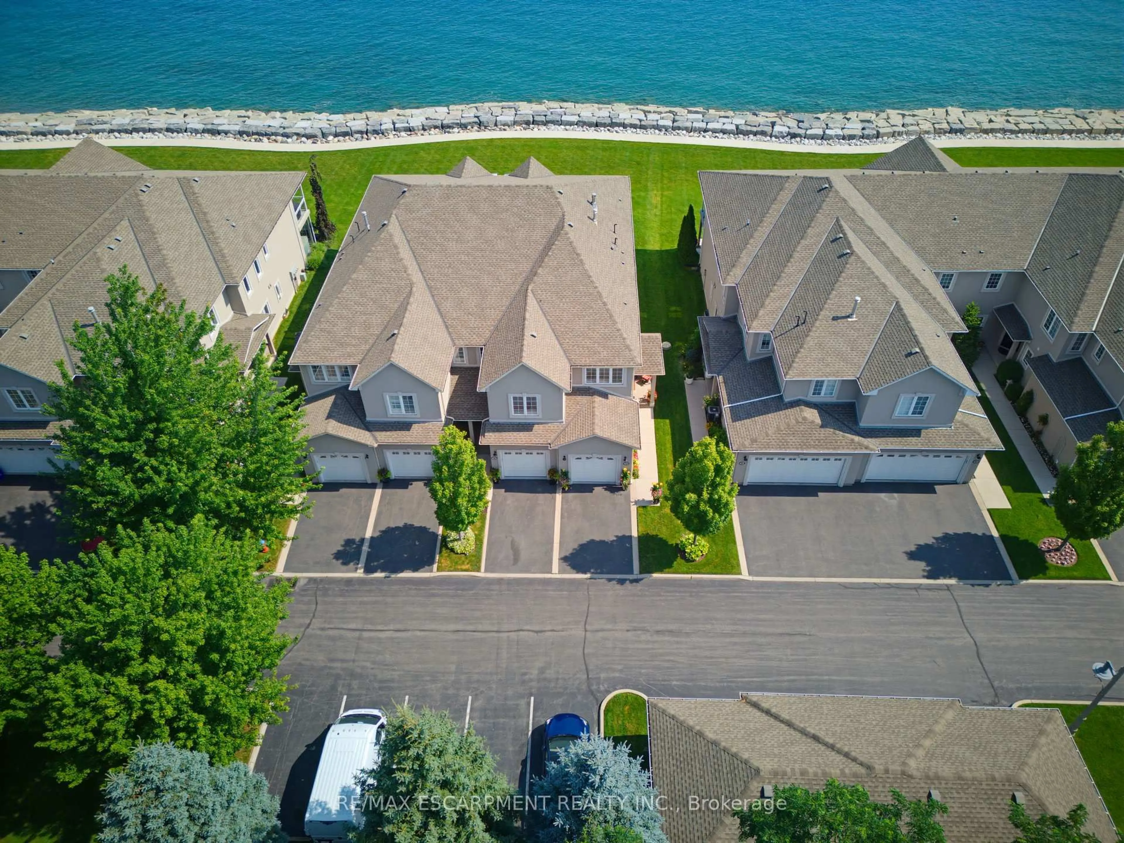 A pic from outside/outdoor area/front of a property/back of a property/a pic from drone, water/lake/river/ocean view for 484 Millen Rd #15, Hamilton Ontario L8E 6G4