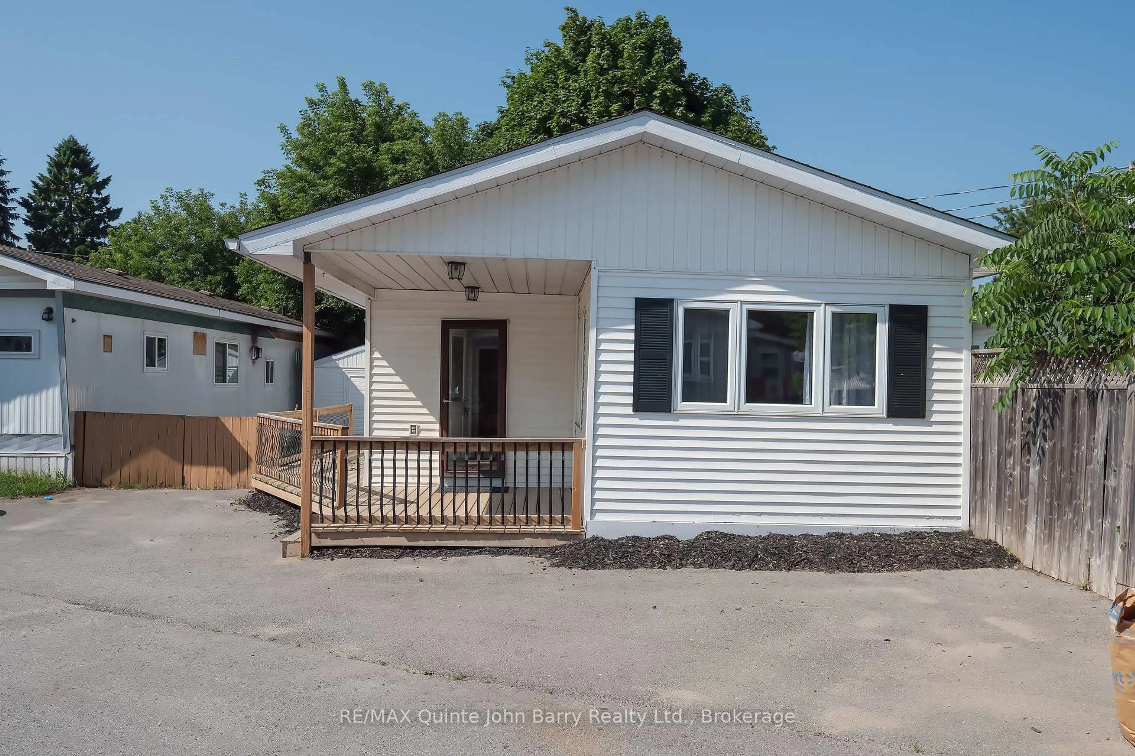 Home with vinyl exterior material, street for 63 Whites Rd #54, Trenton Ontario K8V 5P8