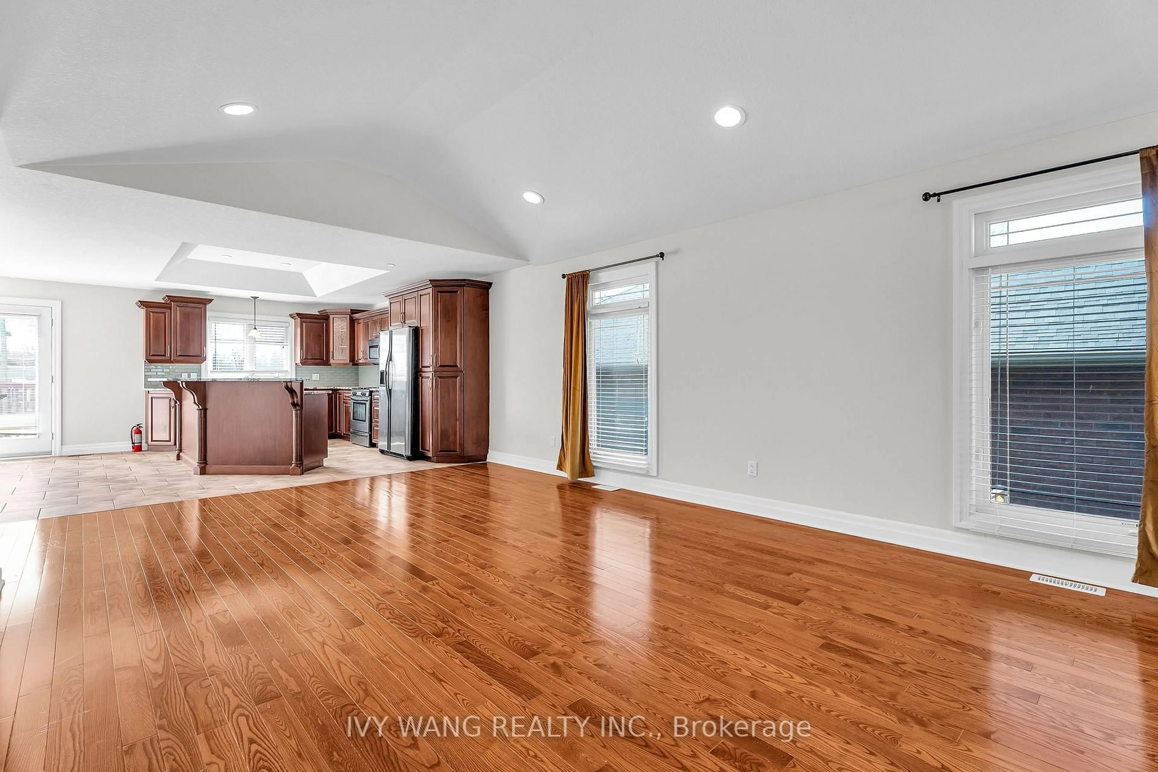 Open concept kitchen, wood/laminate floor for 6675 Beattie St, London South Ontario N6P 1T6