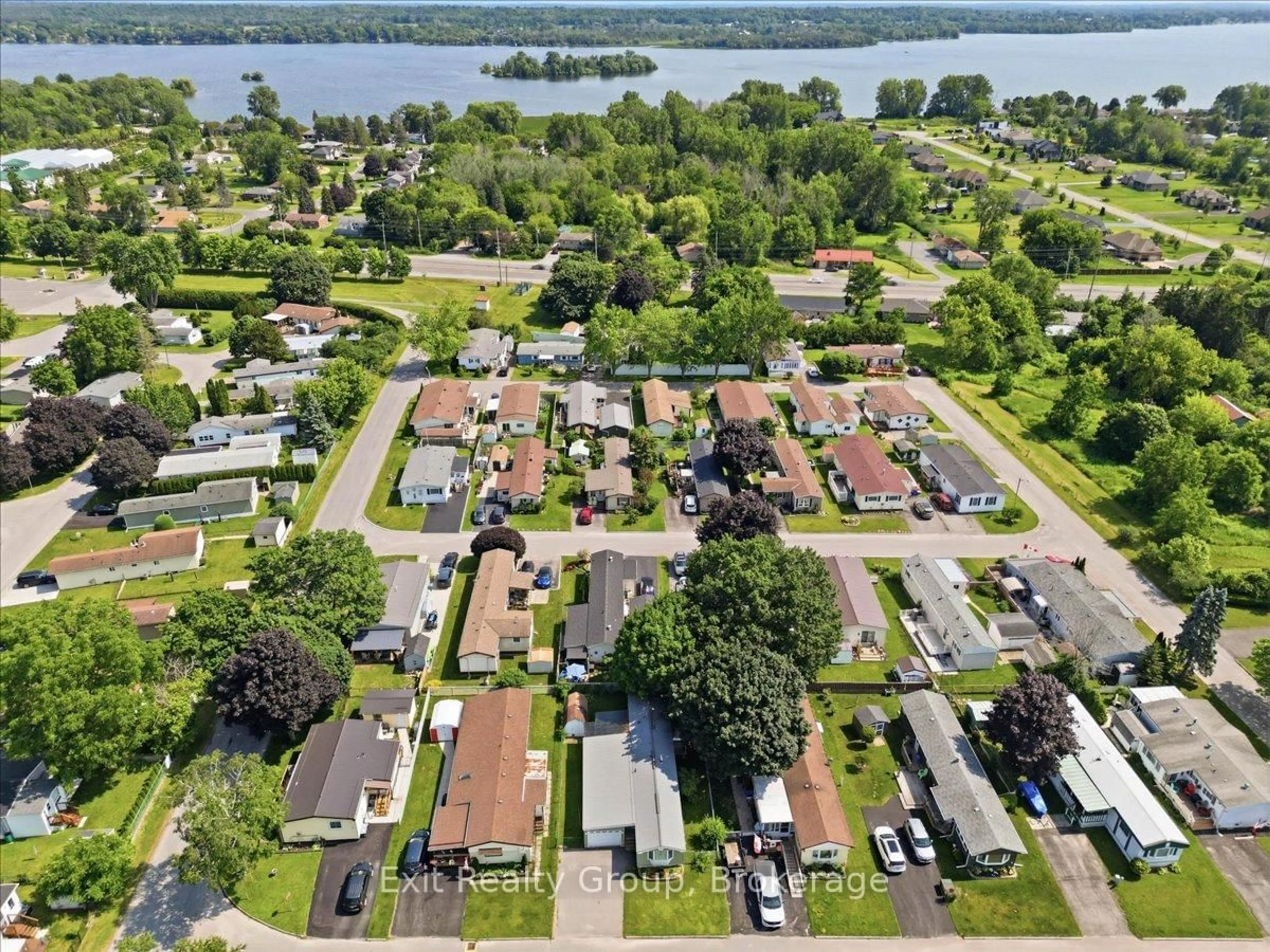 A pic from outside/outdoor area/front of a property/back of a property/a pic from drone, water/lake/river/ocean view for 7 Dove Lane, Quinte West Ontario K8N 4Z3