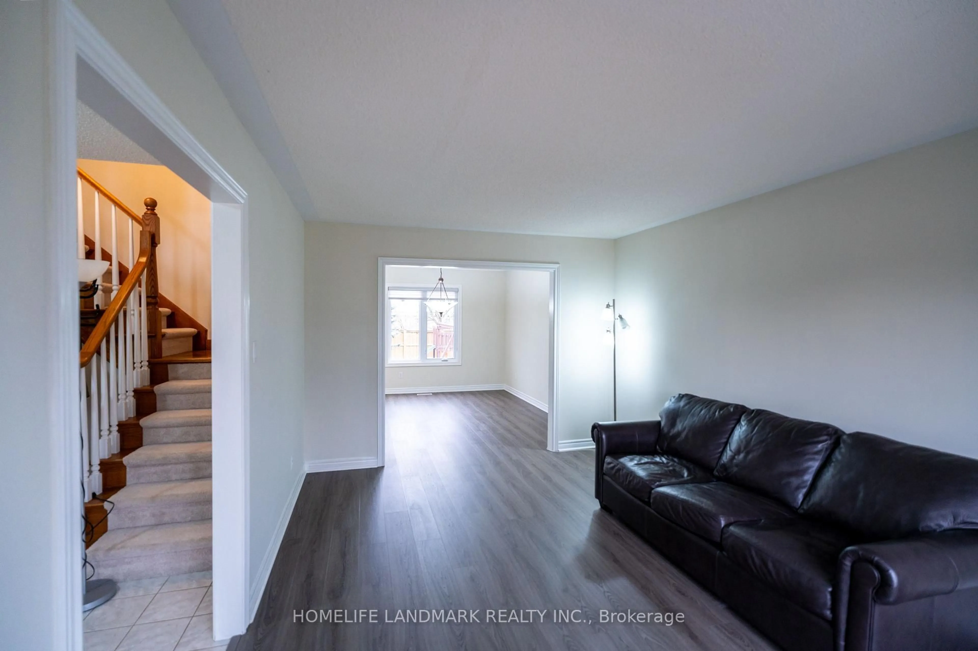 Living room with furniture, wood/laminate floor for 134 Moraine Crt, London North Ontario N6G 4Z1