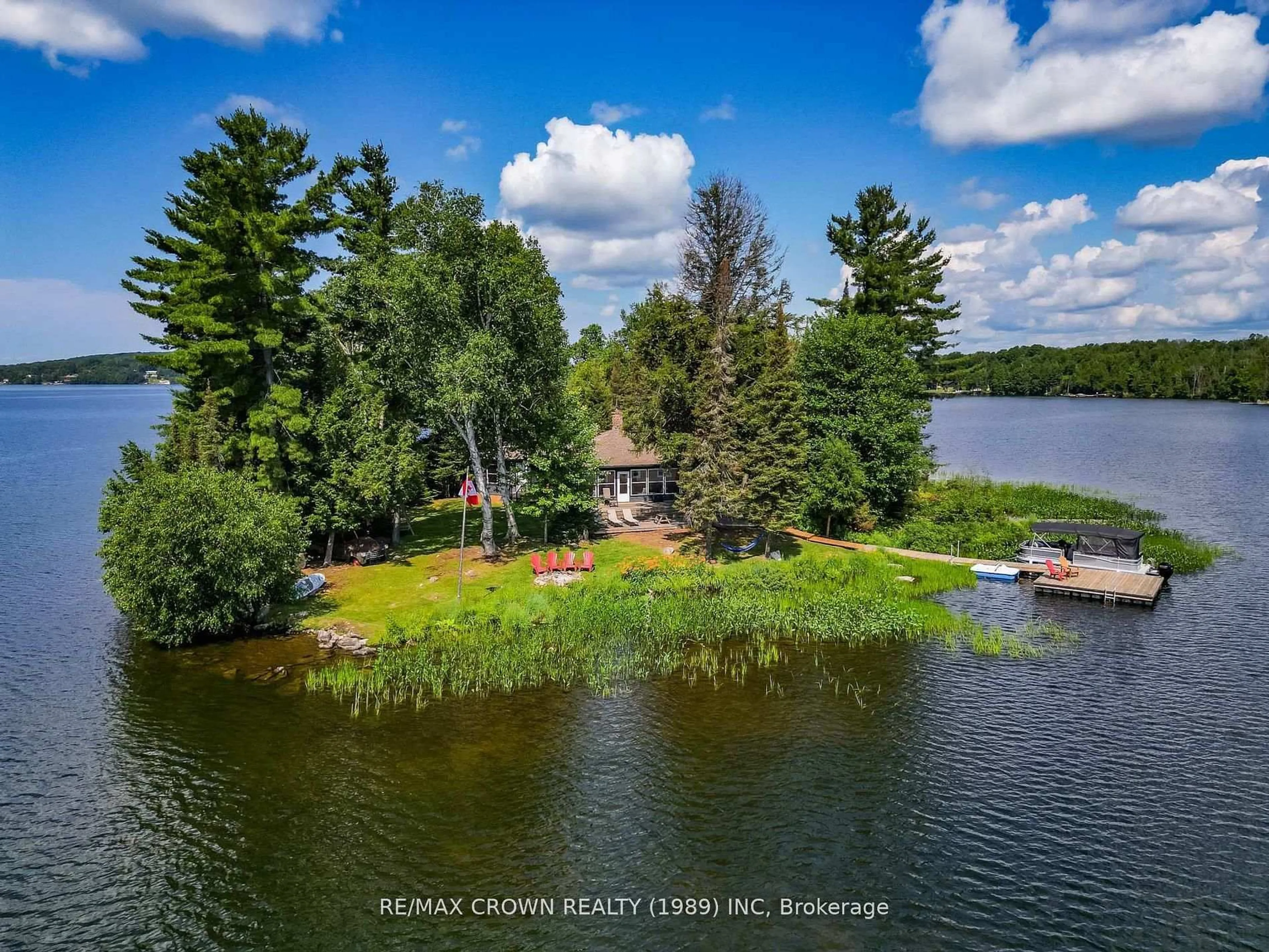 A pic from outside/outdoor area/front of a property/back of a property/a pic from drone, water/lake/river/ocean view for 71 Northwoods Drive C Island, East Ferris Ontario P0H 1K0