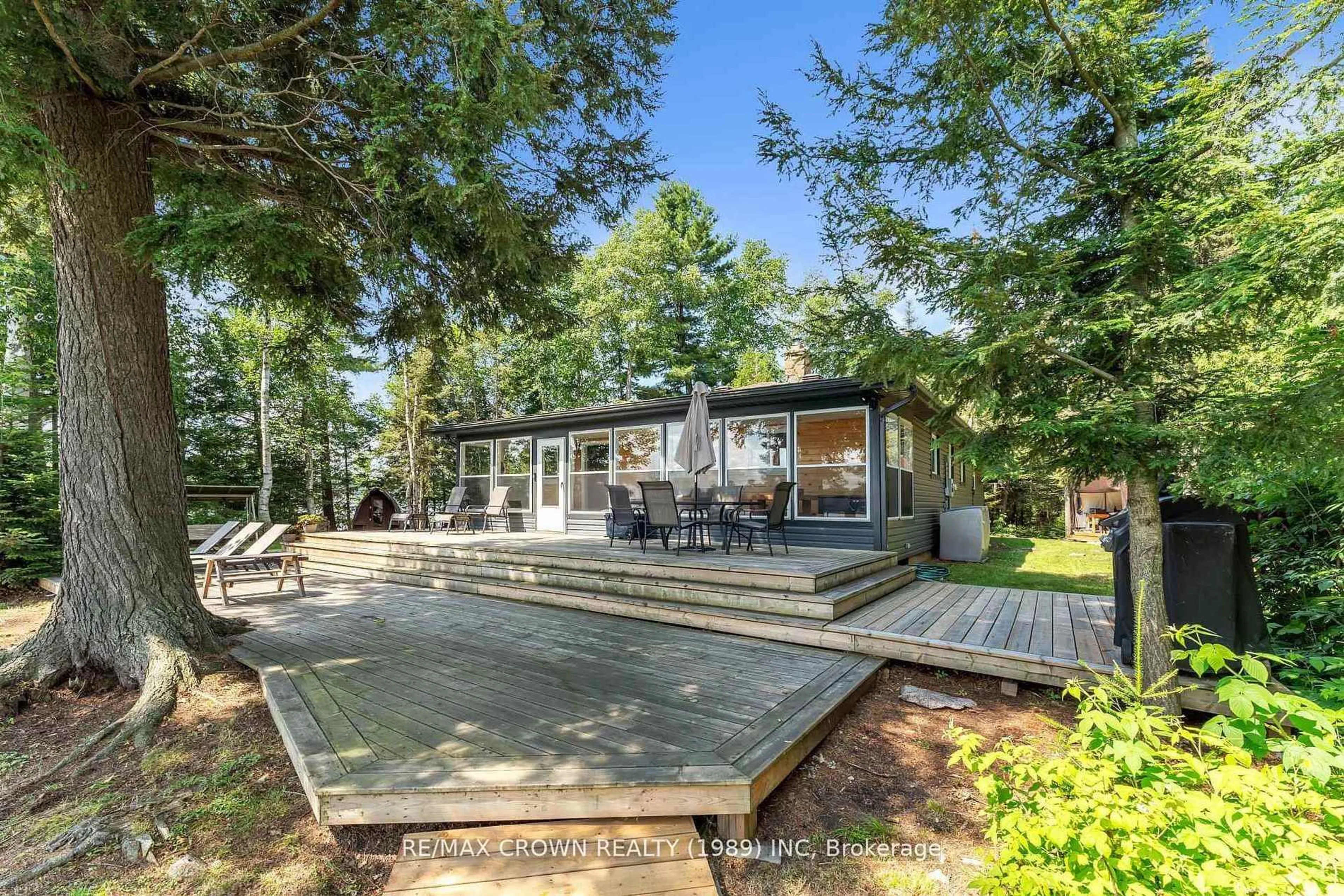 A pic from outside/outdoor area/front of a property/back of a property/a pic from drone, forest/trees view for 71 Northwoods Drive C Island, East Ferris Ontario P0H 1K0