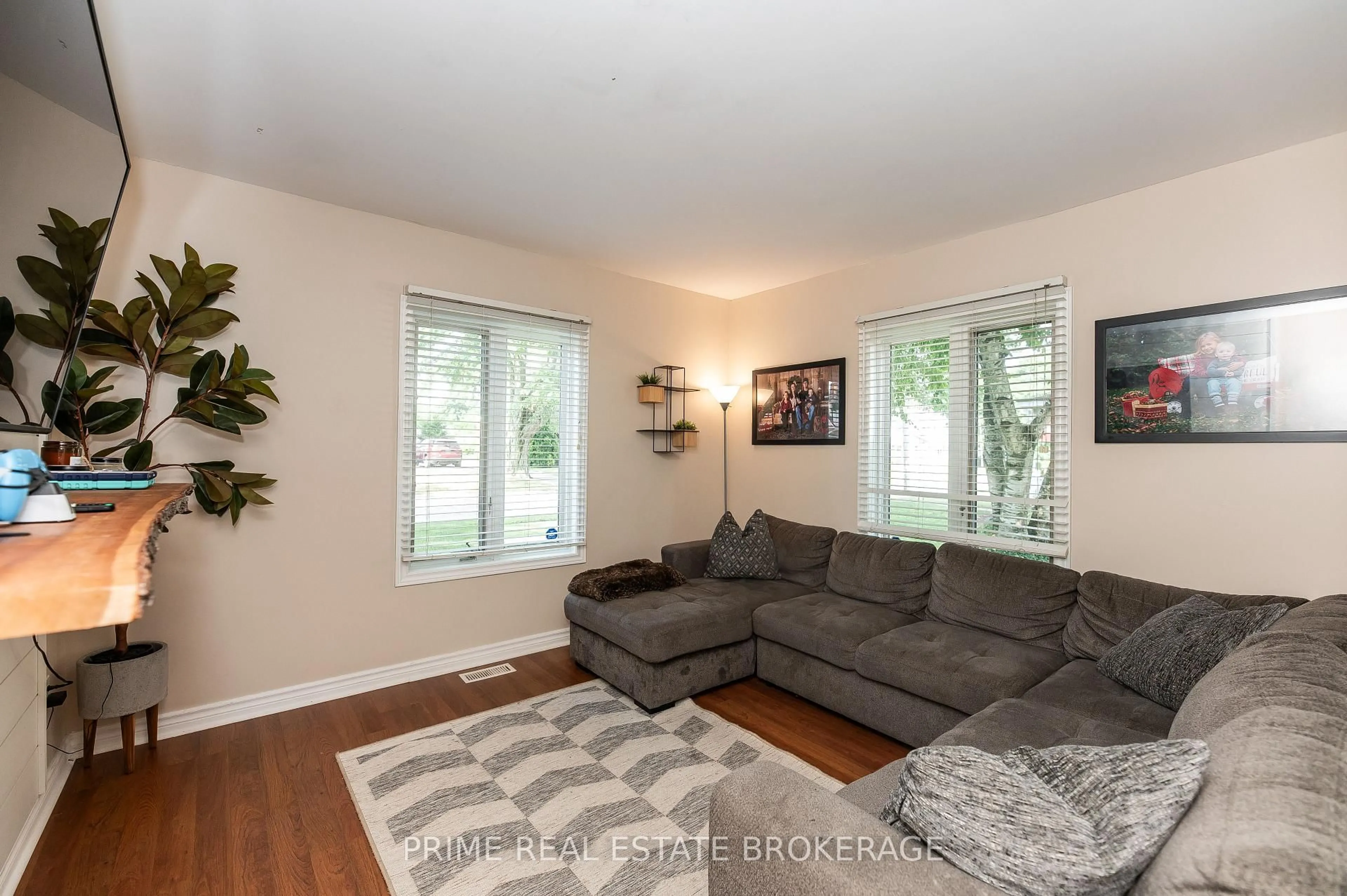 Living room with furniture, wood/laminate floor for 173 Furnival Rd, West Elgin Ontario N0L 2C0