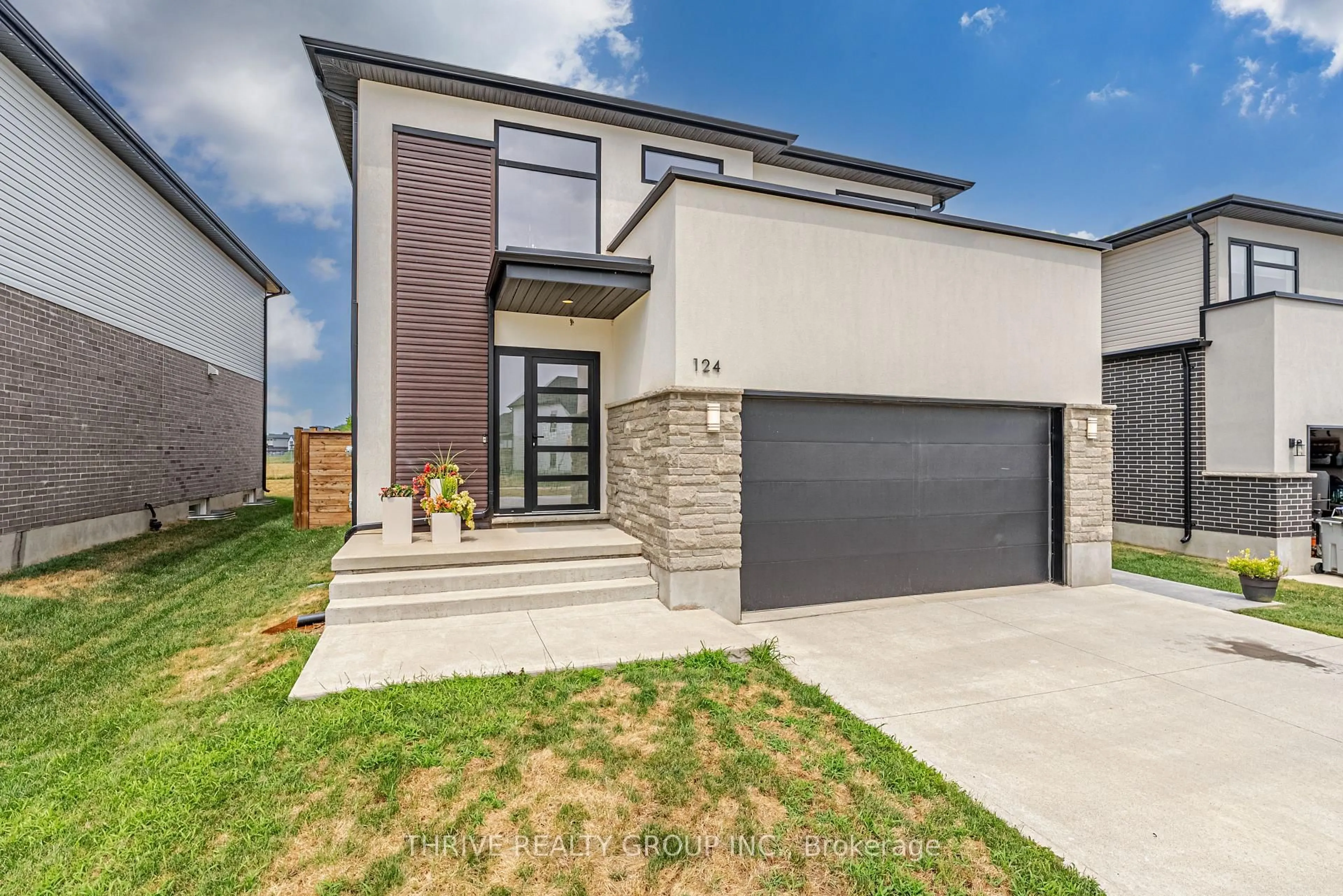 Home with brick exterior material, street for 124 Crestview Dr, Middlesex Centre Ontario N0L 1R0