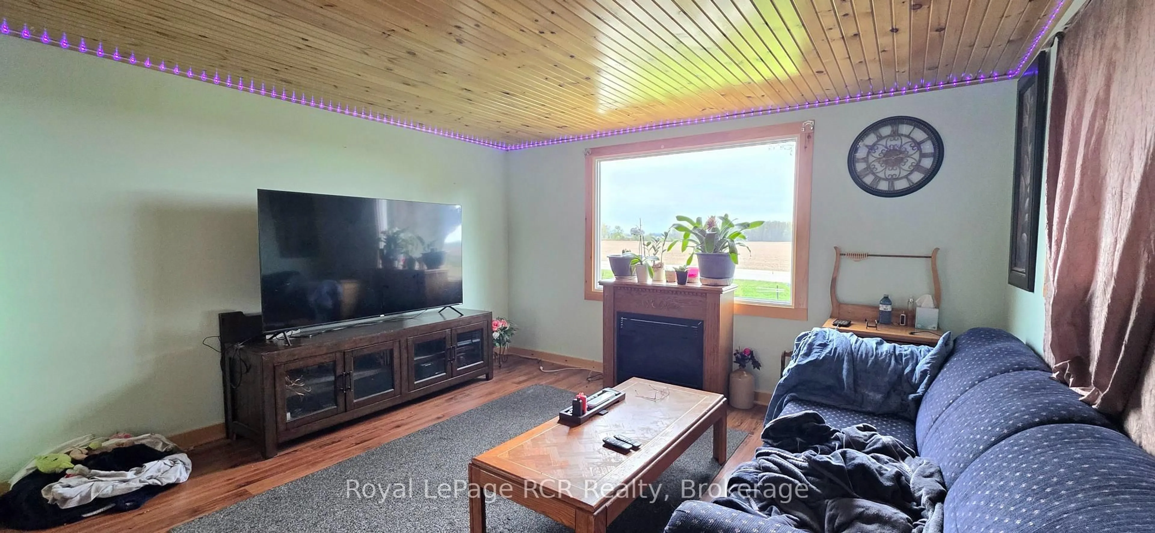 Living room with furniture, wood/laminate floor for 10 Quebec Rd, Huron East Ontario N0M 1L0