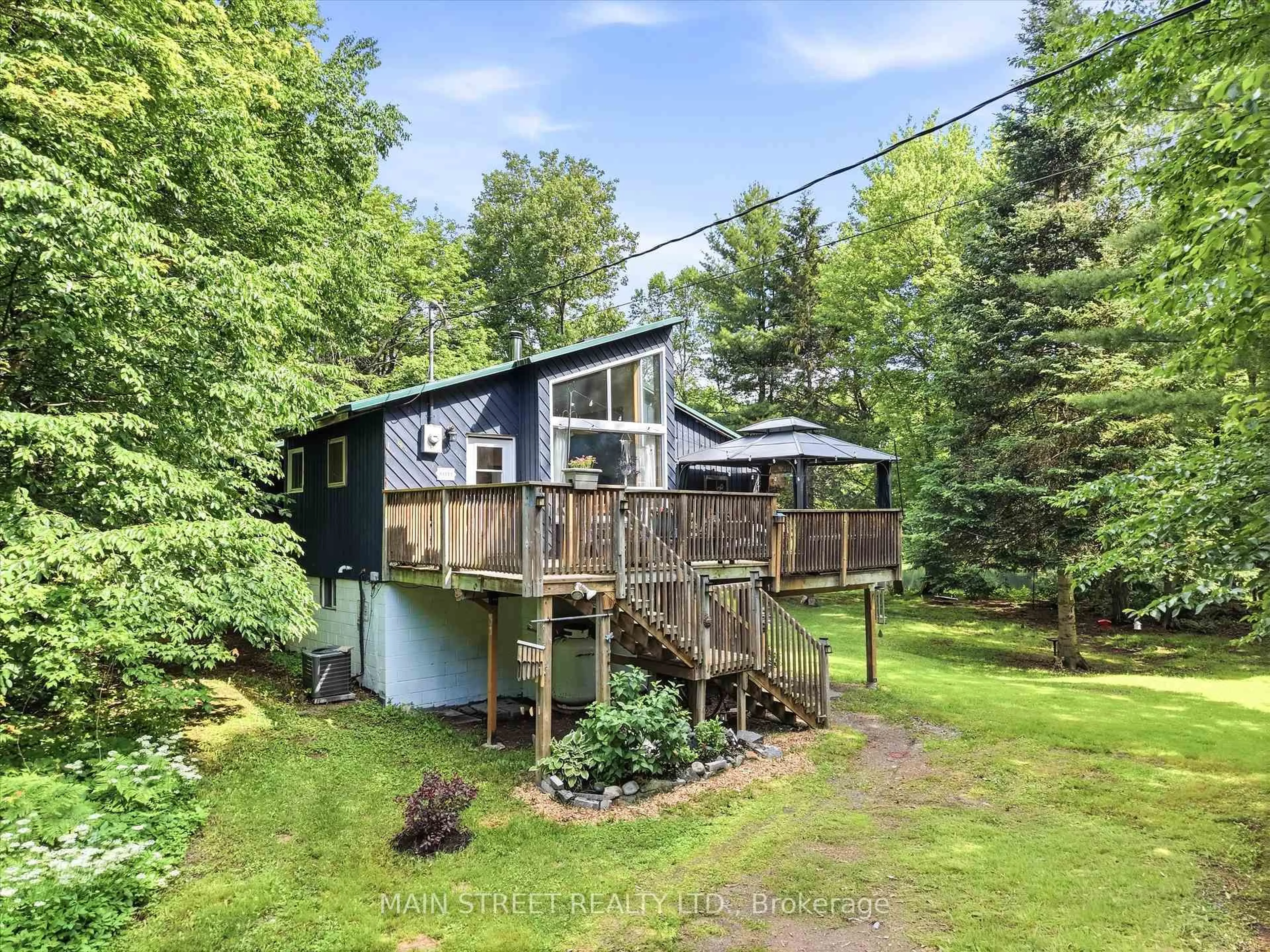 A pic from outside/outdoor area/front of a property/back of a property/a pic from drone, water/lake/river/ocean view for 1063 SHERWOOD FOREST Rd, Bracebridge Ontario P1L 1X3