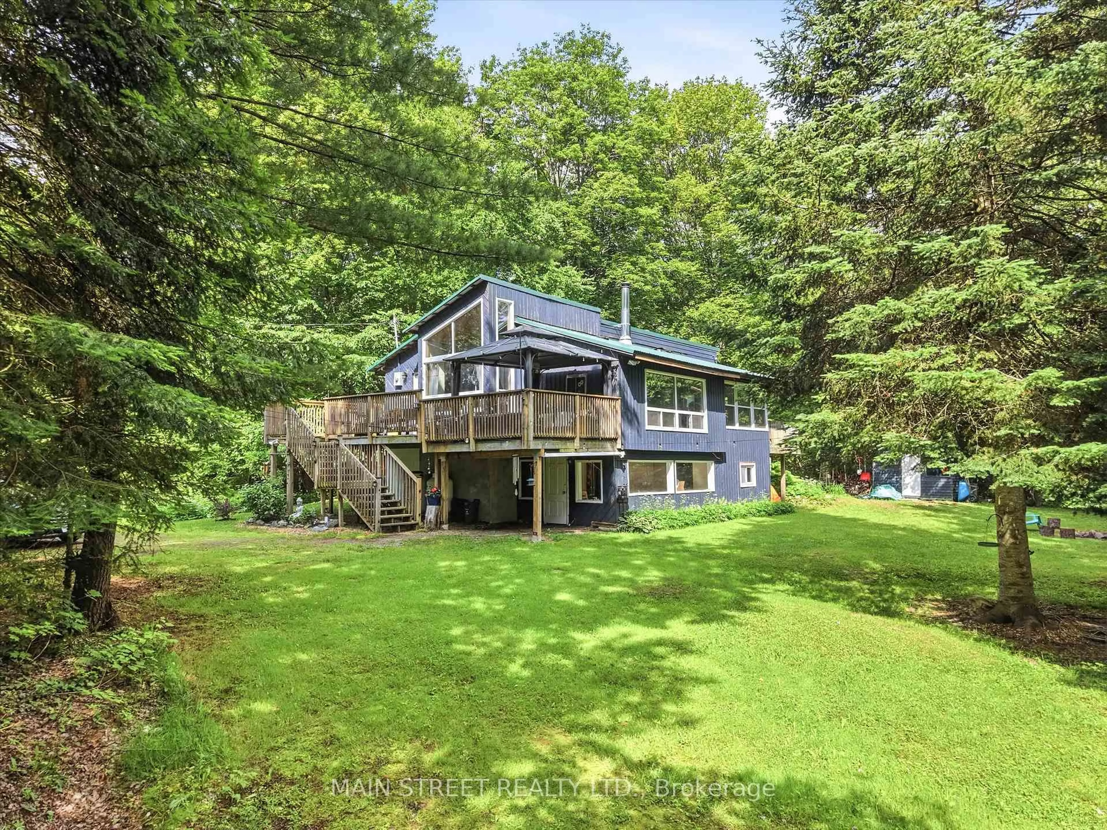 A pic from outside/outdoor area/front of a property/back of a property/a pic from drone, water/lake/river/ocean view for 1063 SHERWOOD FOREST Rd, Bracebridge Ontario P1L 1X3