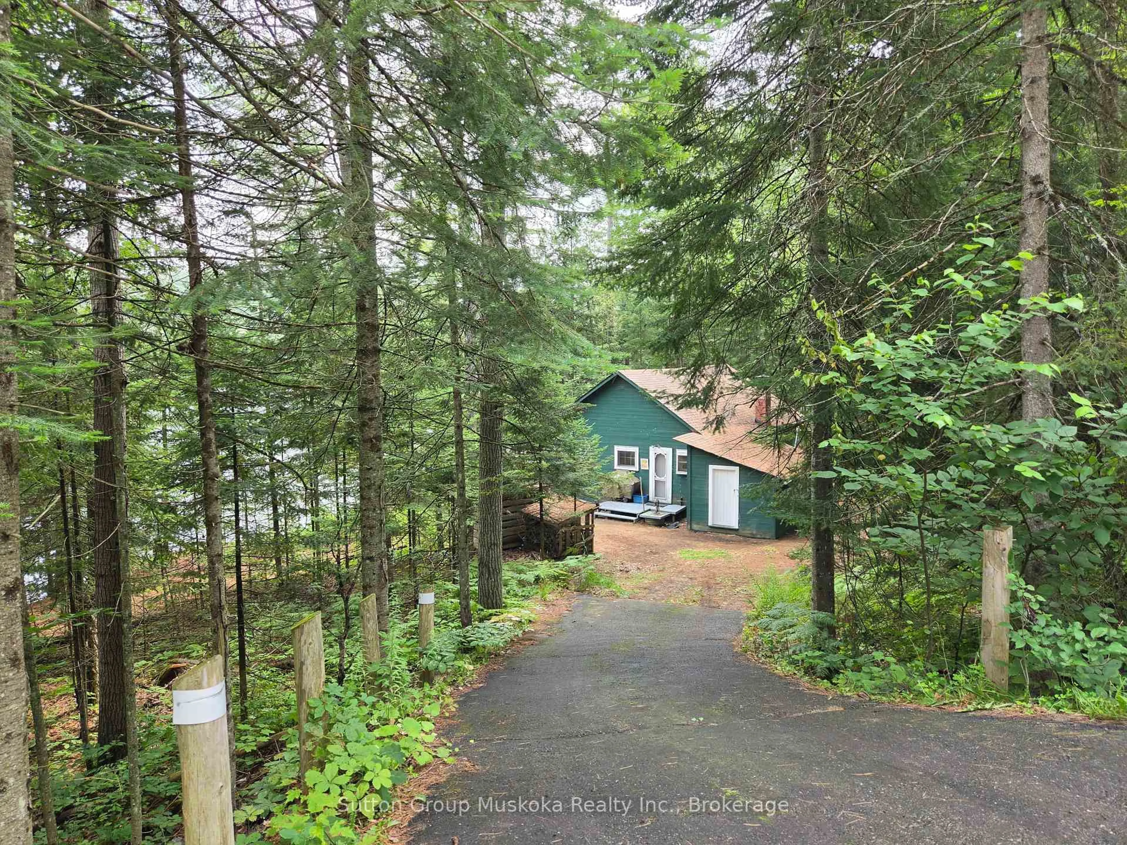 A pic from outside/outdoor area/front of a property/back of a property/a pic from drone, forest/trees view for 699 South Mary Lake Rd, Huntsville Ontario P0B 1L0