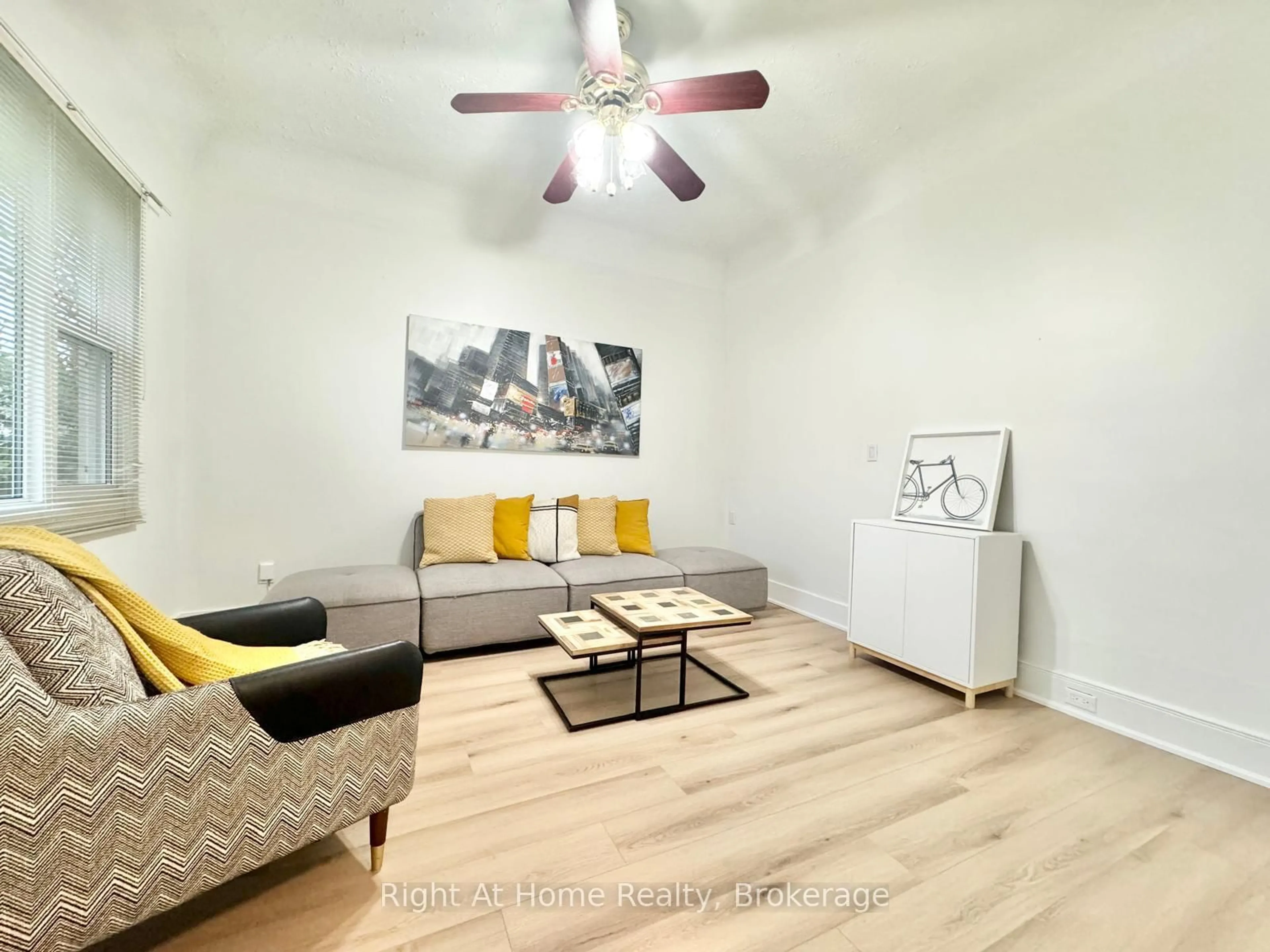 Living room with furniture, wood/laminate floor for 216 Hatt St, Hamilton Ontario L9H 2G8