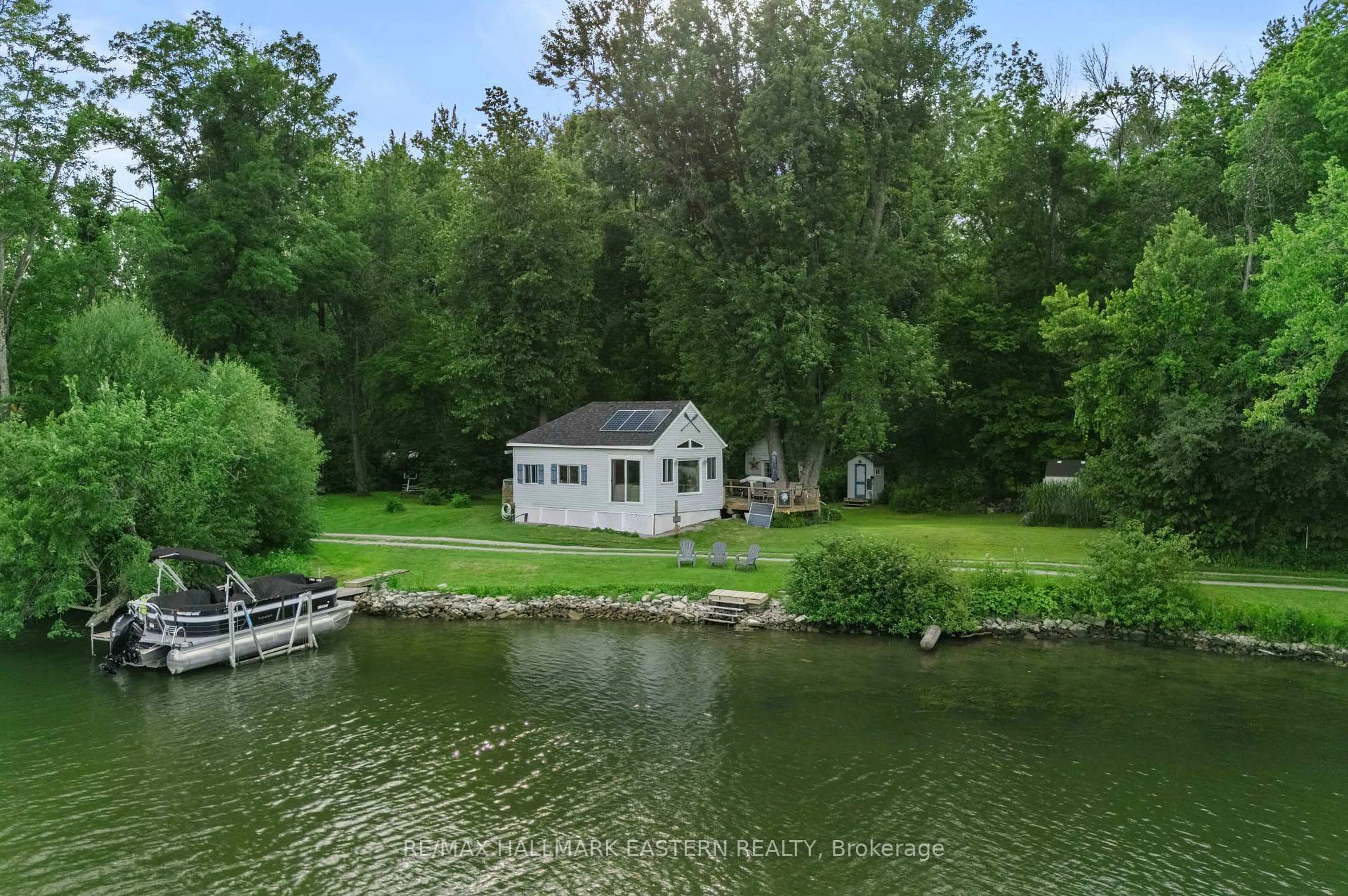 A pic from outside/outdoor area/front of a property/back of a property/a pic from drone, water/lake/river/ocean view for 730 Mervin Line, Cavan Monaghan Ontario K9J 6Z9