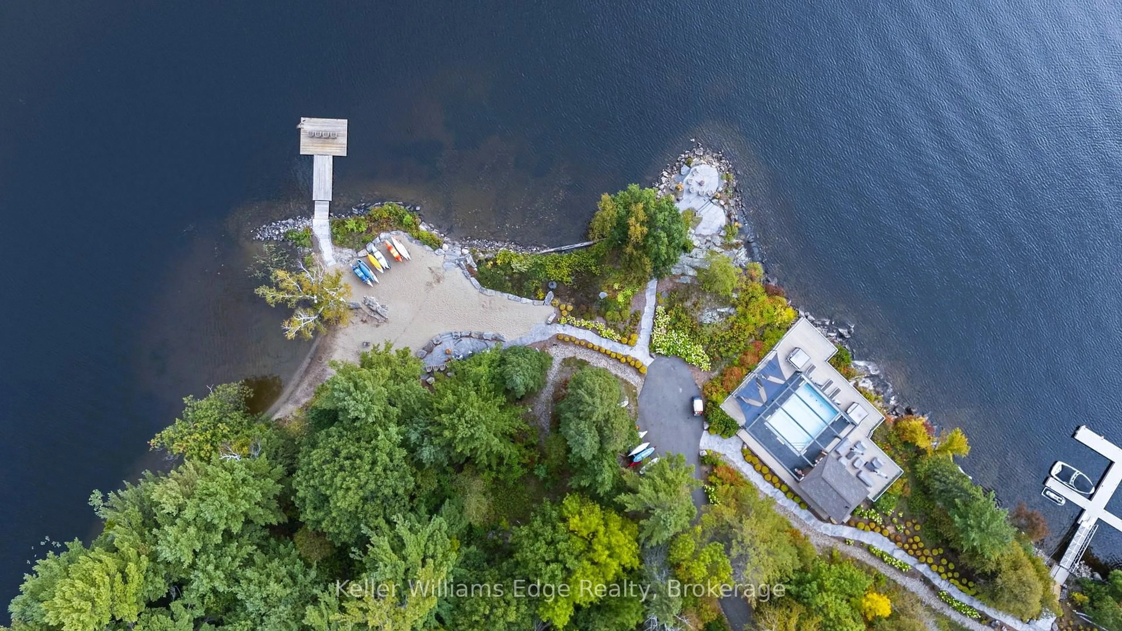 A pic from outside/outdoor area/front of a property/back of a property/a pic from drone, water/lake/river/ocean view for 727 Grandview Dr #209, Huntsville Ontario P1H 2J5