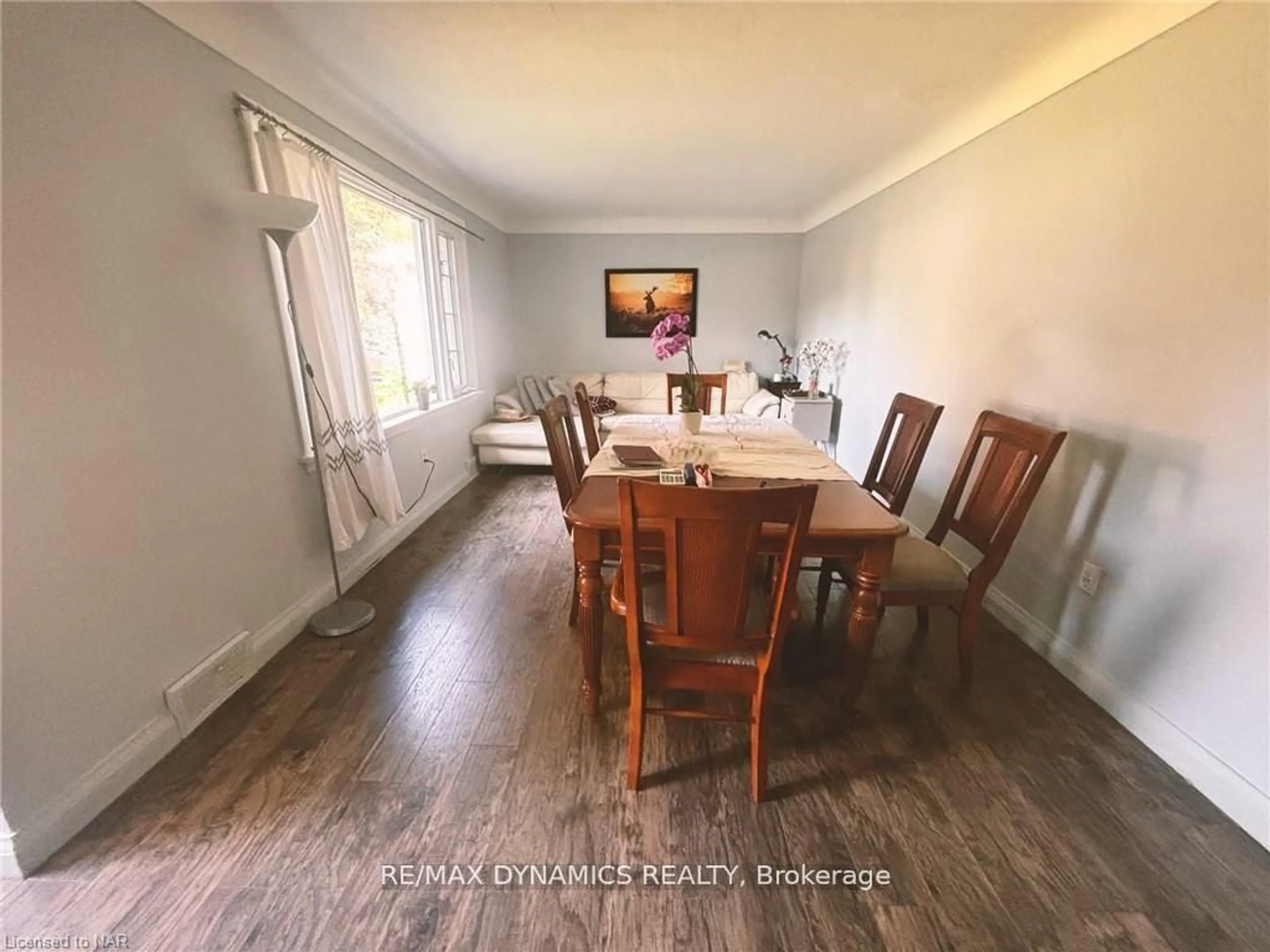Dining room, wood/laminate floor for 26 Beamer Ave, St. Catharines Ontario L2M 2L3