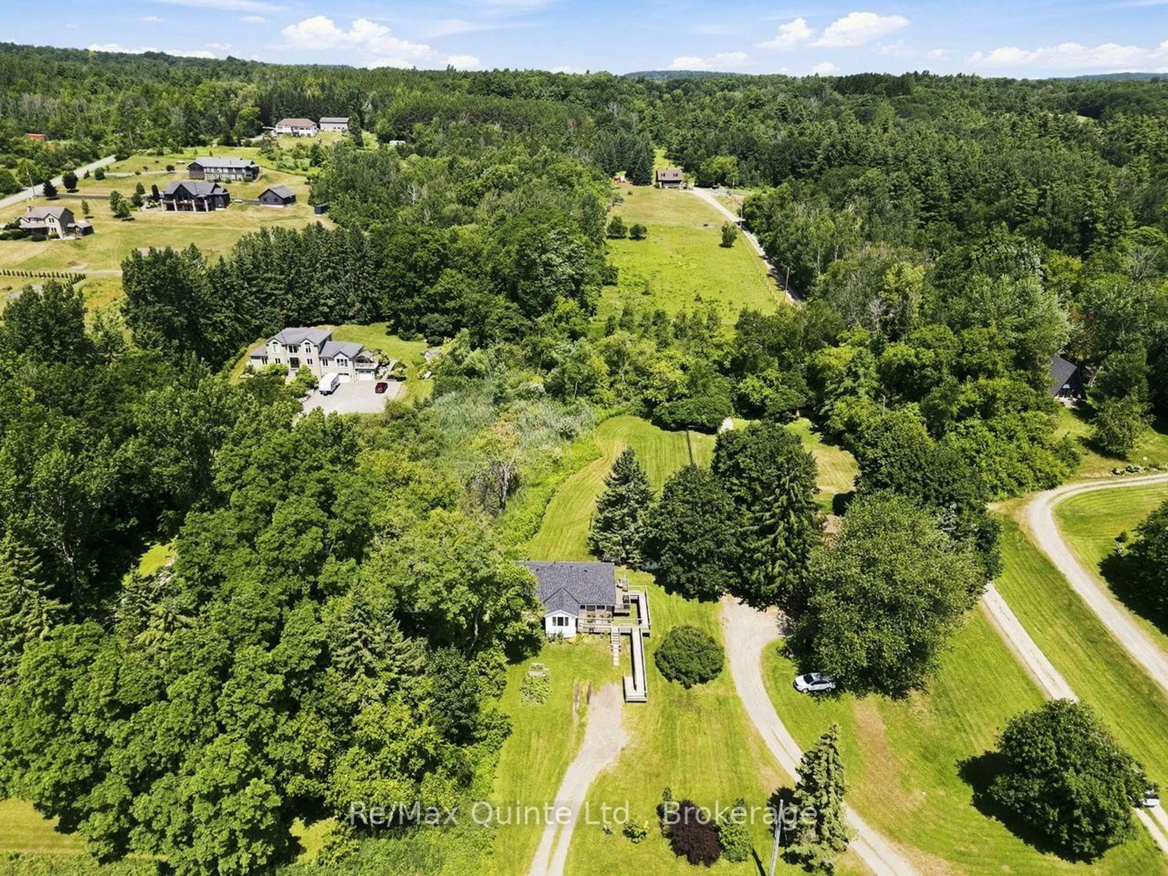 A pic from outside/outdoor area/front of a property/back of a property/a pic from drone, forest/trees view for 15150 County Rd 2, Brighton Ontario K0K 1H0
