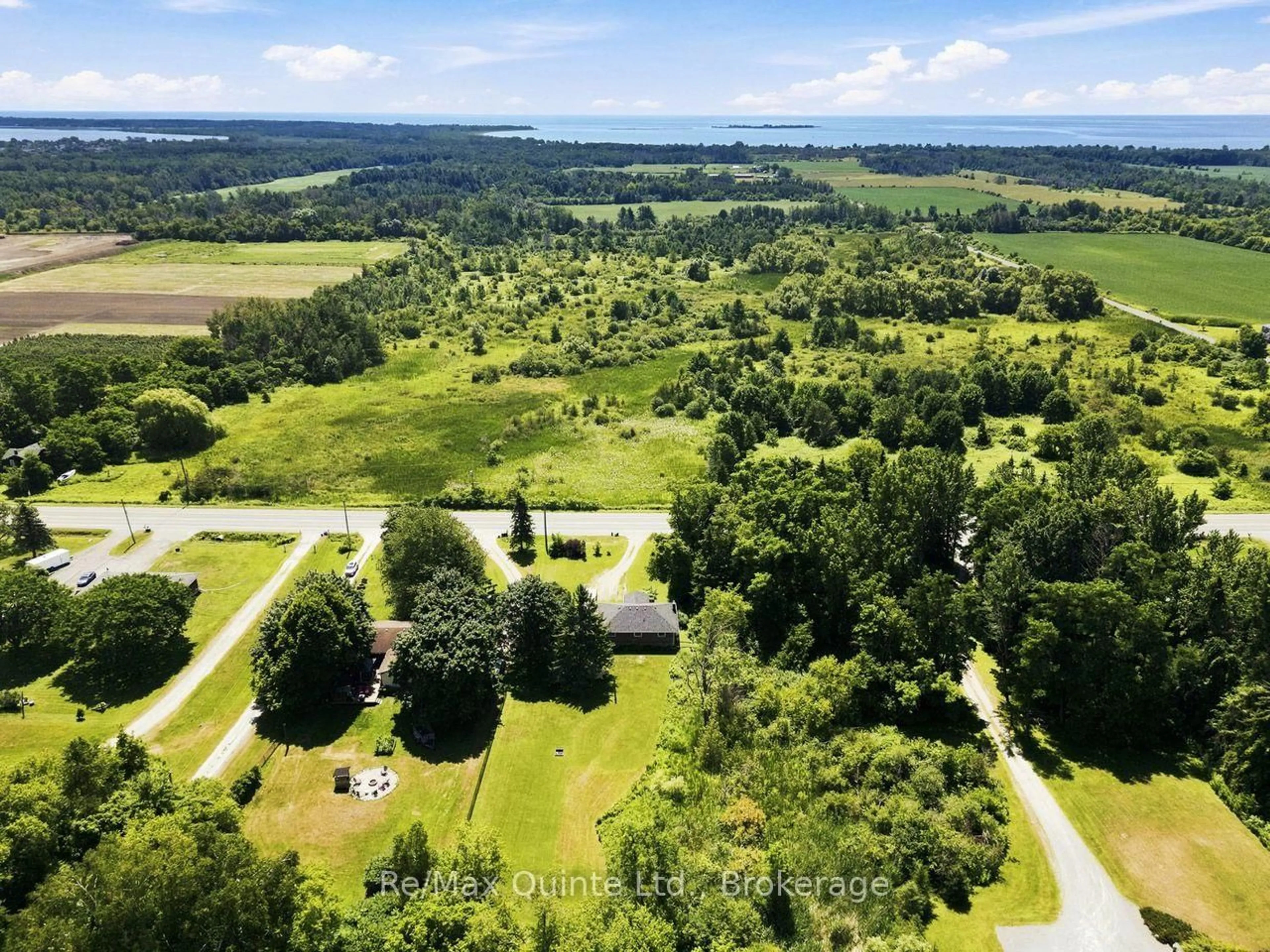 A pic from outside/outdoor area/front of a property/back of a property/a pic from drone, forest/trees view for 15150 County Rd 2, Brighton Ontario K0K 1H0