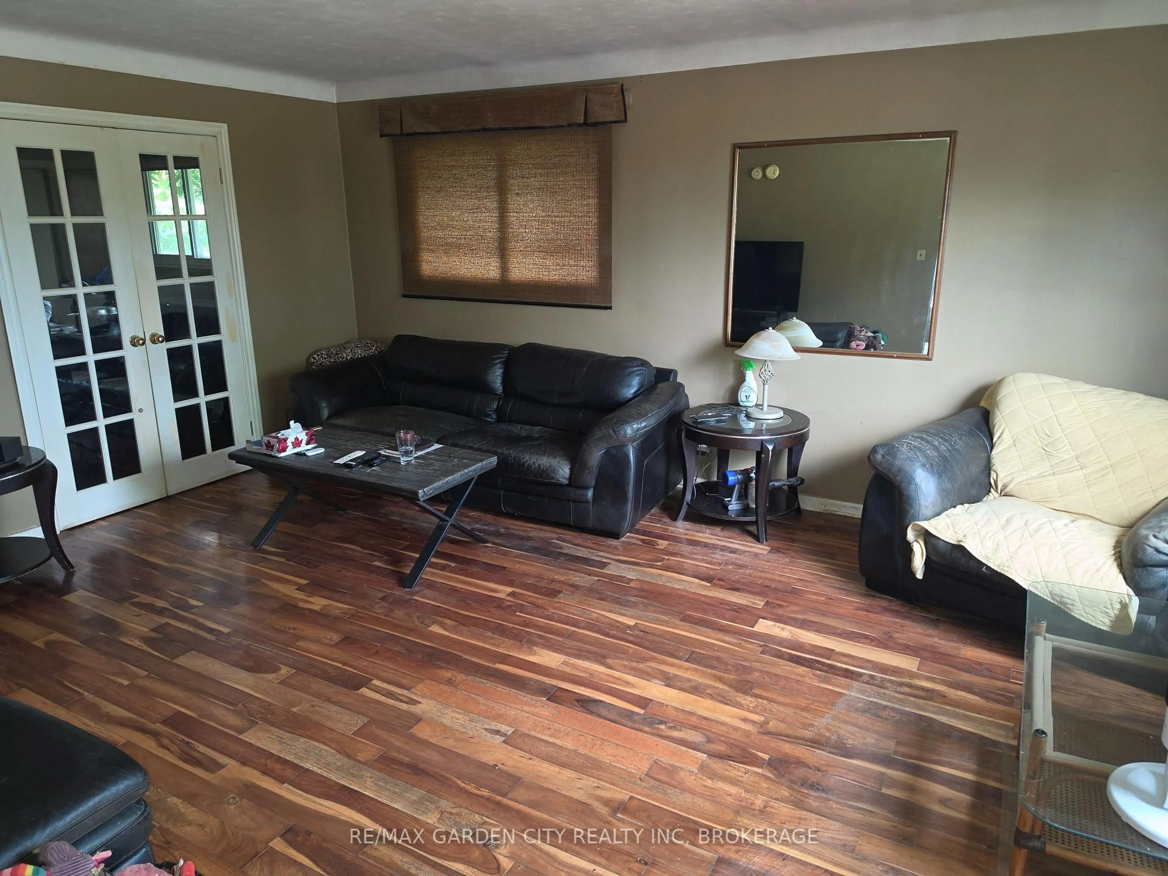 Living room with furniture, wood/laminate floor for 49 Ursula Ave, St. Catharines Ontario L2T 1T2