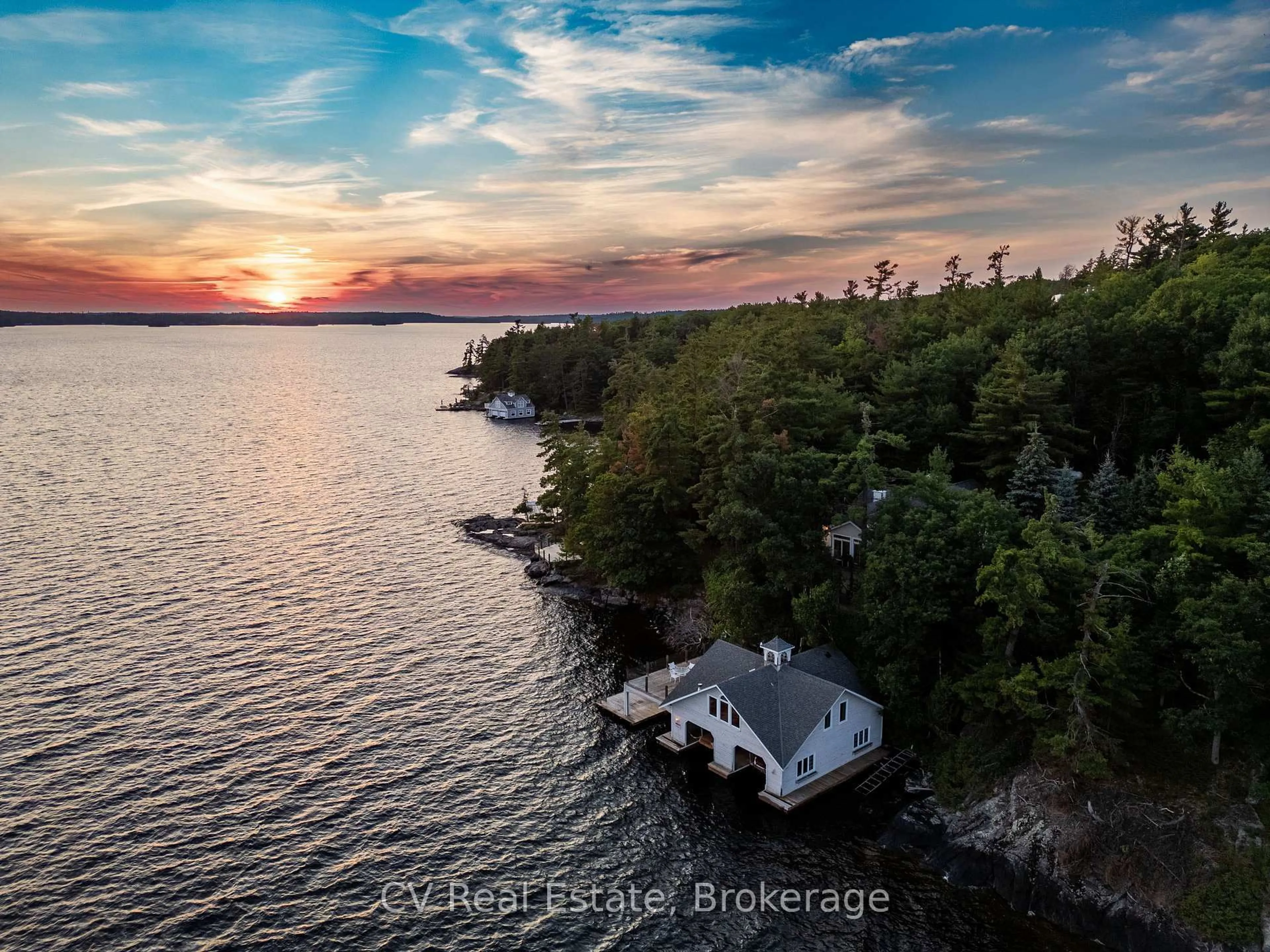A pic from outside/outdoor area/front of a property/back of a property/a pic from drone, water/lake/river/ocean view for 1210 Ennis Bay Rd, Bracebridge Ontario P1L 1X2