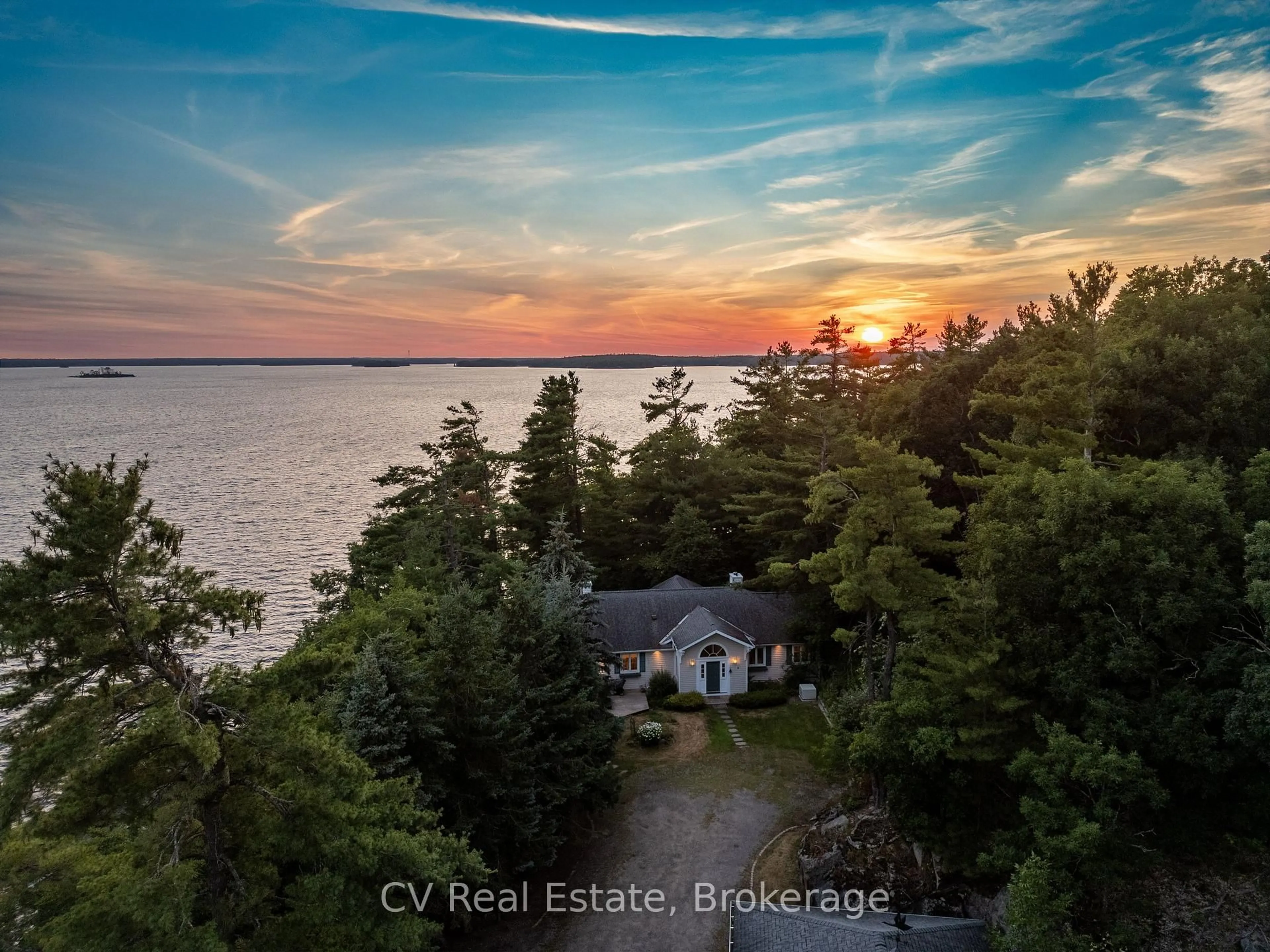 A pic from outside/outdoor area/front of a property/back of a property/a pic from drone, water/lake/river/ocean view for 1210 Ennis Bay Rd, Bracebridge Ontario P1L 1X2