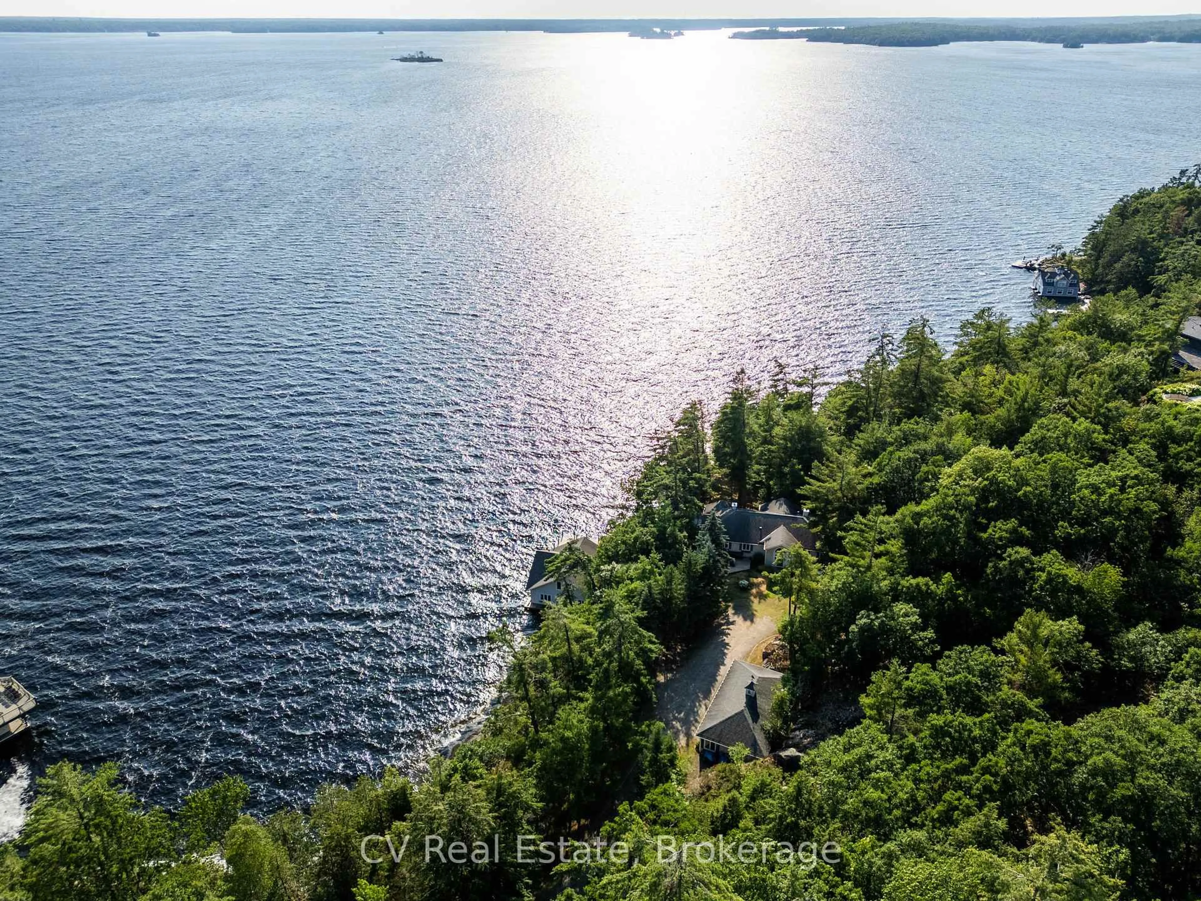 A pic from outside/outdoor area/front of a property/back of a property/a pic from drone, water/lake/river/ocean view for 1210 Ennis Bay Rd, Bracebridge Ontario P1L 1X2