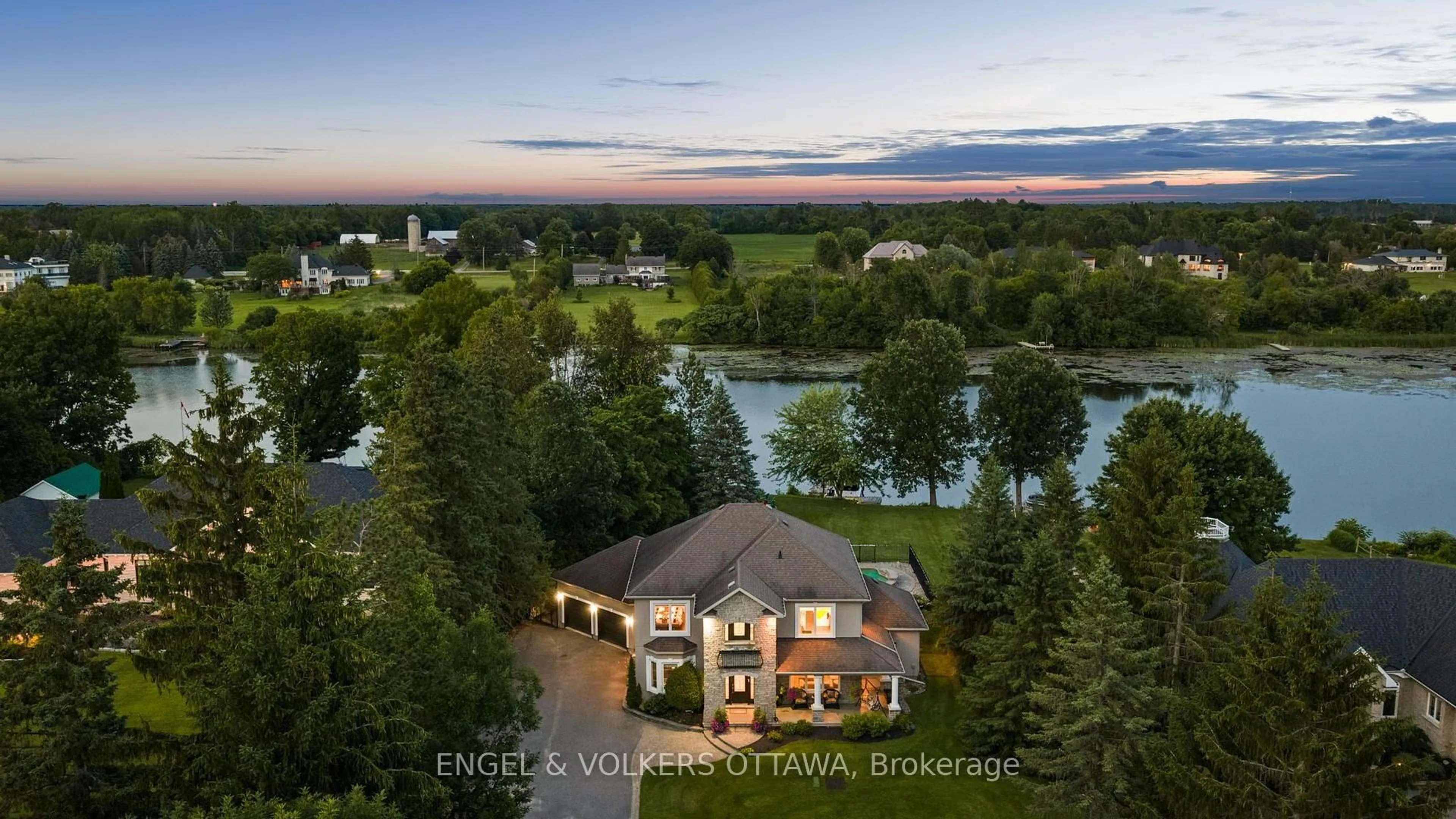 A pic from outside/outdoor area/front of a property/back of a property/a pic from drone, water/lake/river/ocean view for 5833A Rideau Valley Dr, Manotick Ontario K4M 1B3