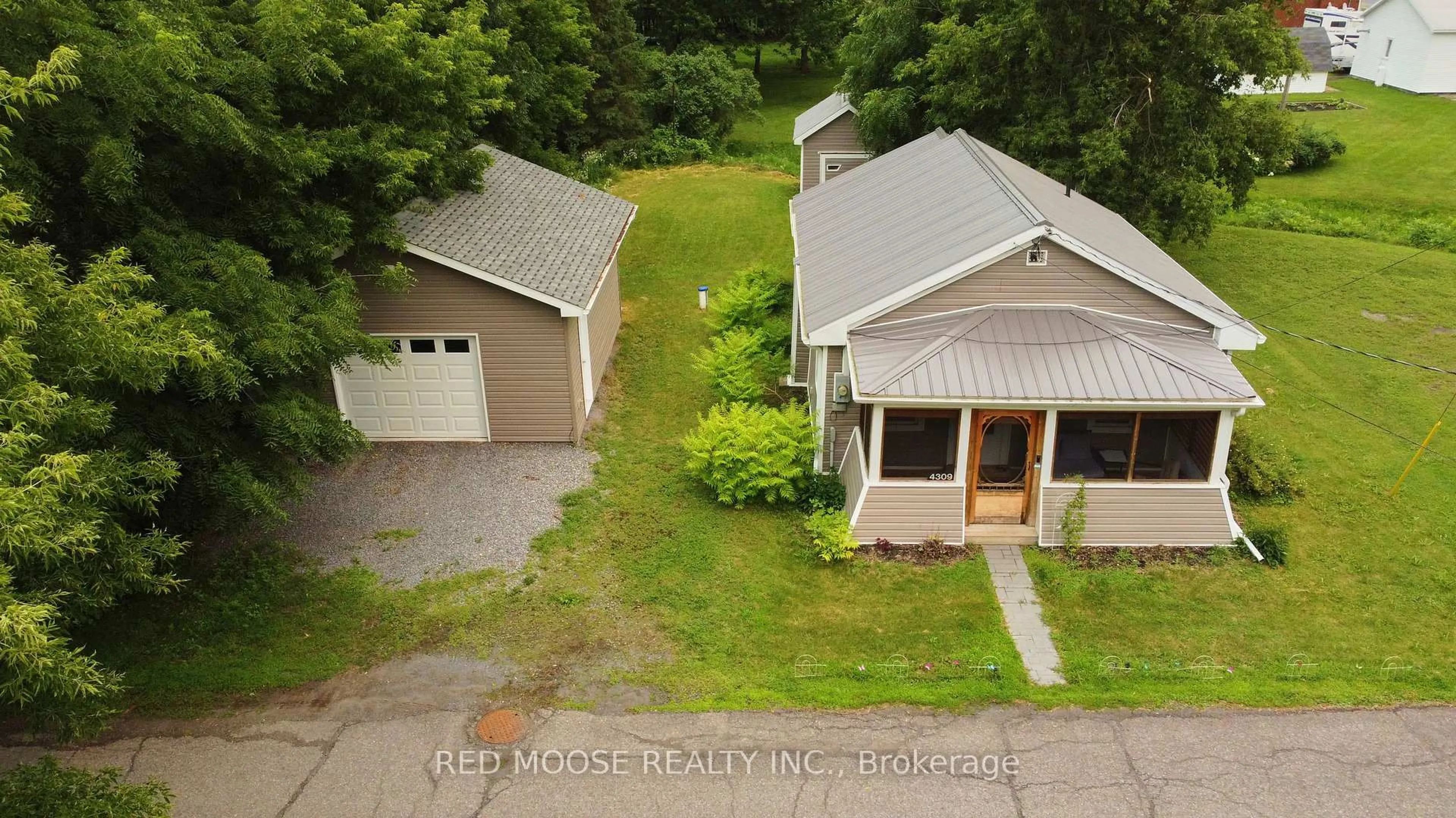A pic from outside/outdoor area/front of a property/back of a property/a pic from drone, street for 4309 Locke Lane, South Dundas Ontario K0C 2H0