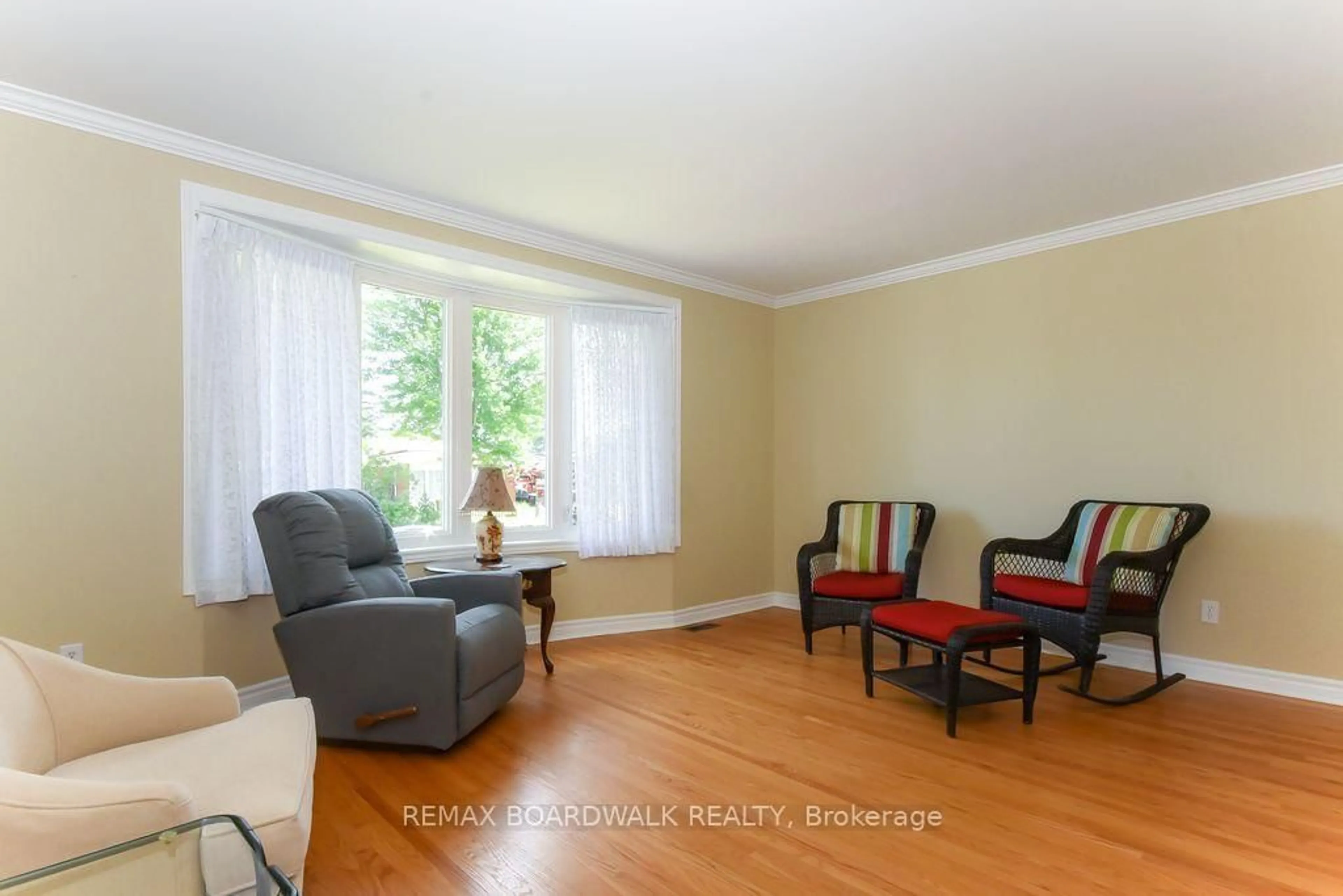 Living room with furniture, wood/laminate floor for 1392 Chartrand Ave, Orleans Ontario K1E 1H8
