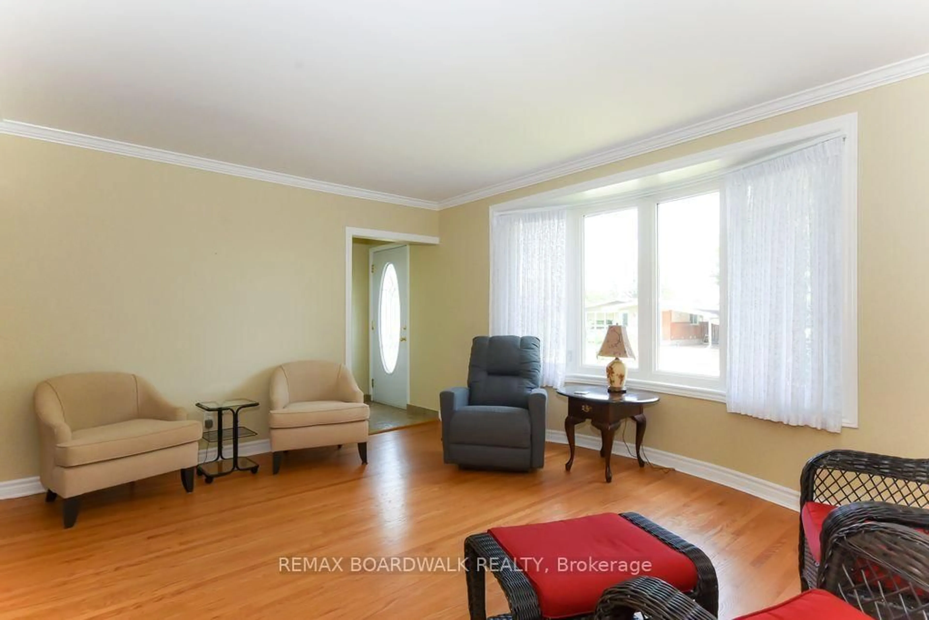 Living room with furniture, wood/laminate floor for 1392 Chartrand Ave, Orleans Ontario K1E 1H8