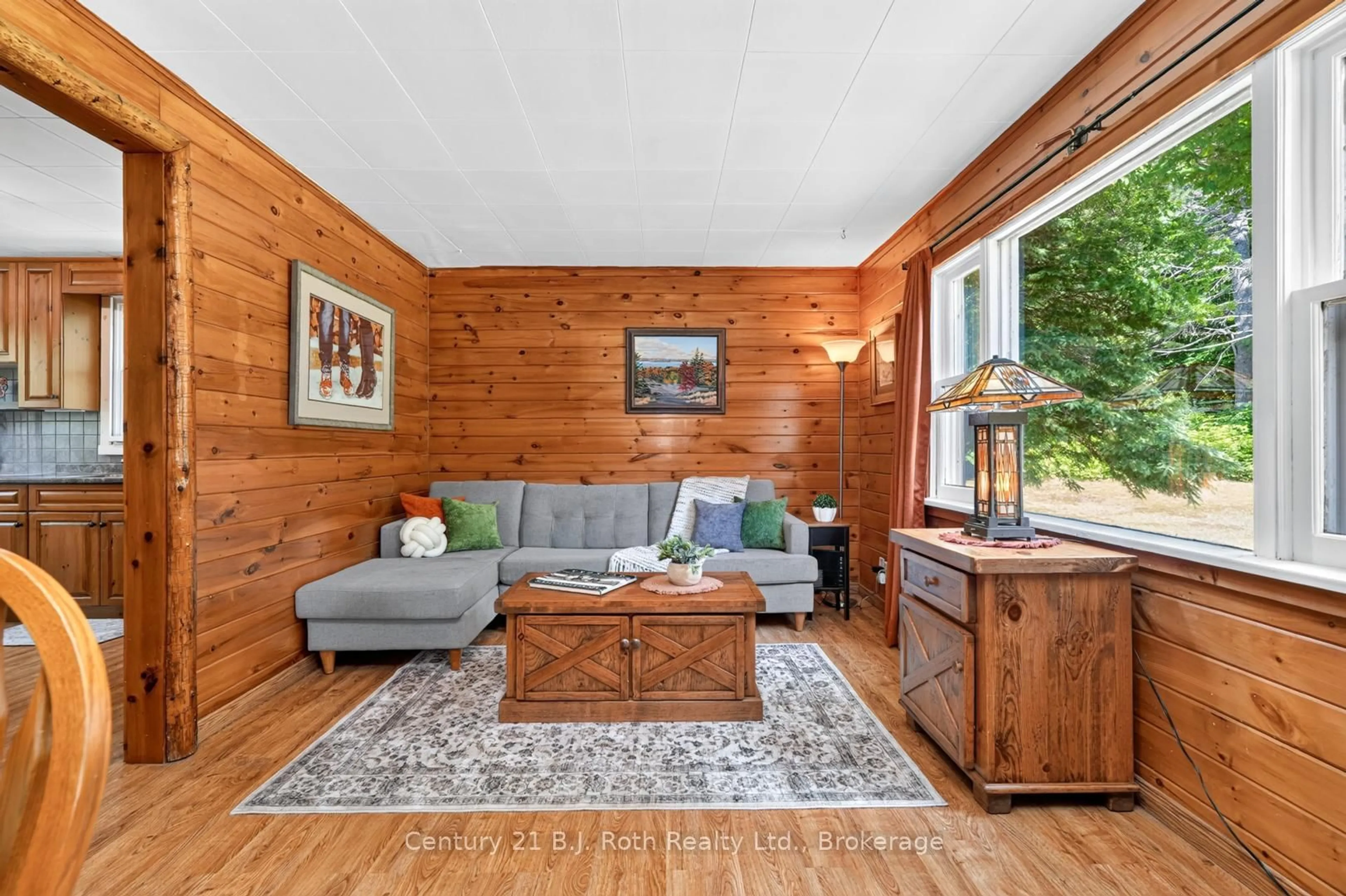 Living room with furniture, wood/laminate floor for 1020 Rosseau Lake Road 1, Muskoka Lakes Ontario P0B 1P0