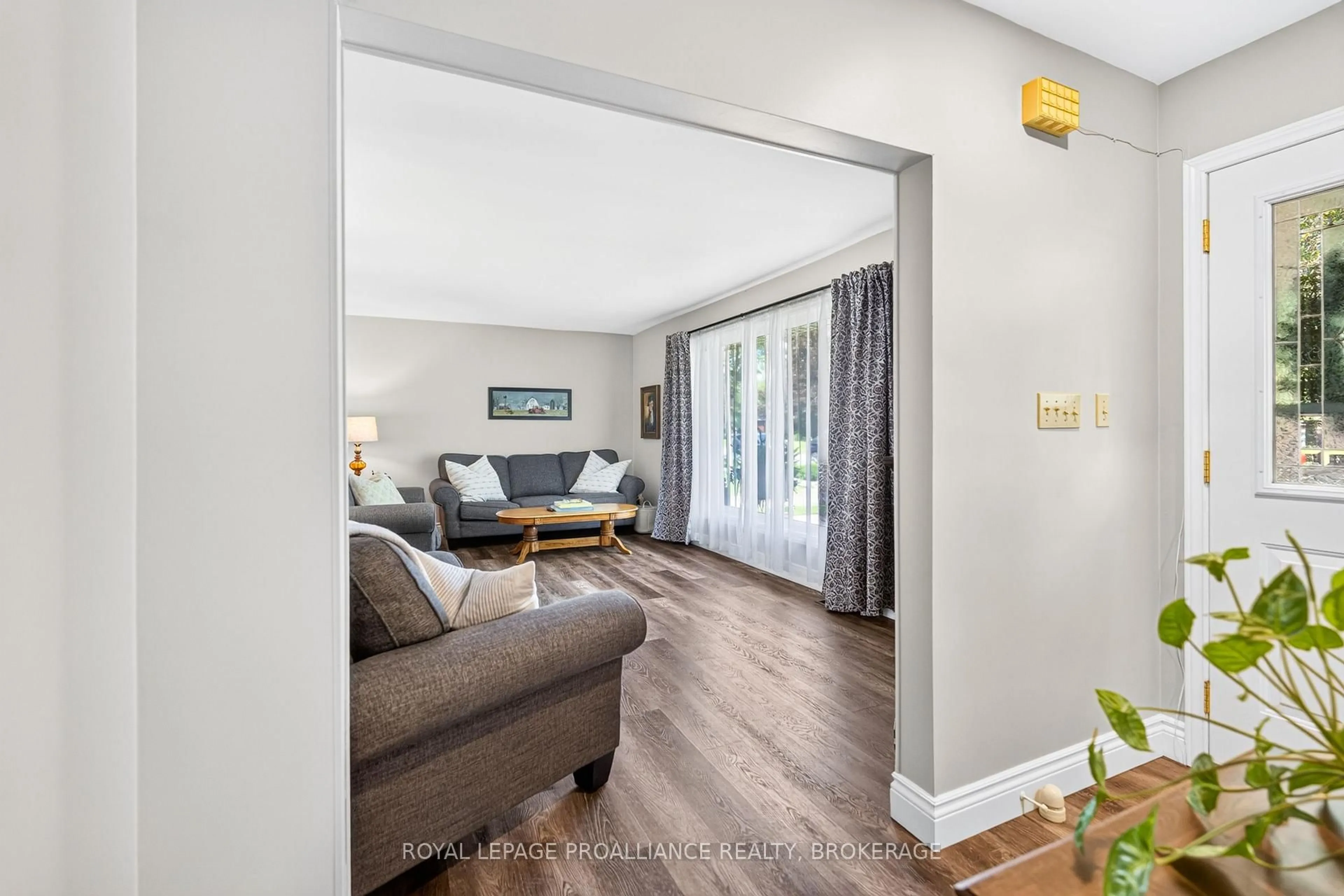 Living room with furniture, wood/laminate floor for 47 Riverview Dr, Greater Napanee Ontario K7R 3A1