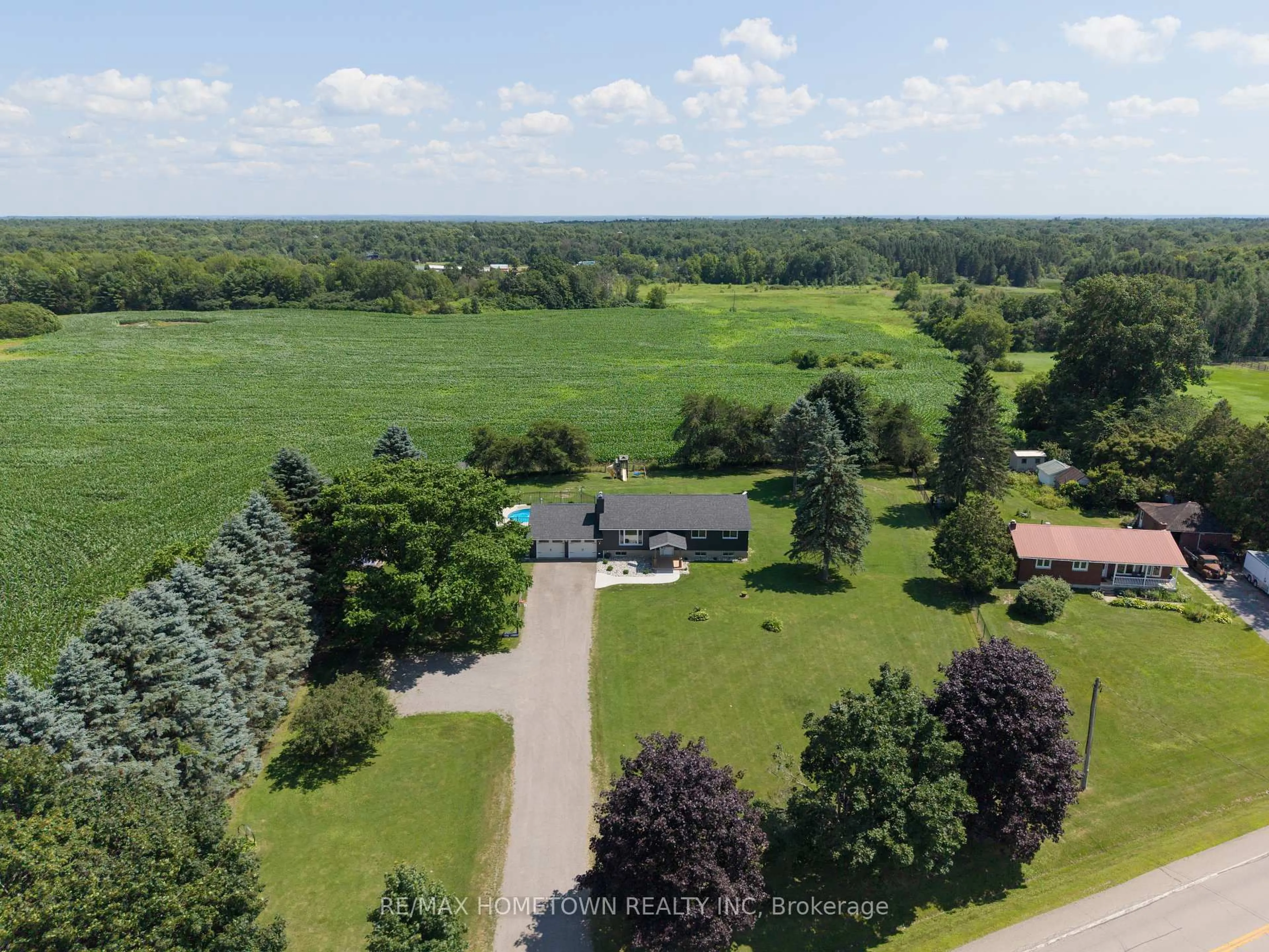 A pic from outside/outdoor area/front of a property/back of a property/a pic from drone, unknown for 1585 County Road 2 Rd, Front of Yonge Ontario K0E 1R0