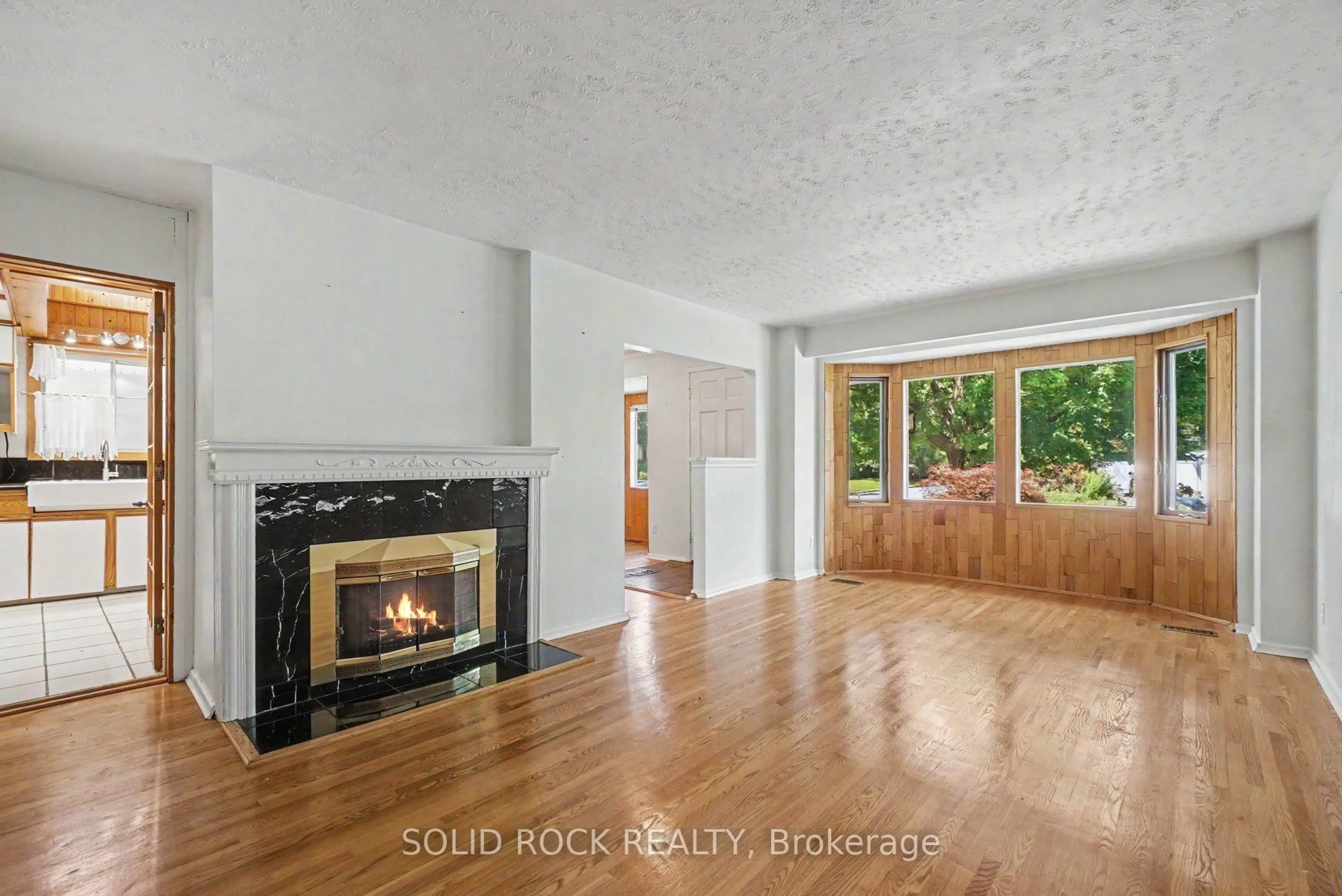 Living room with furniture, wood/laminate floor for 1838 Louisiana Ave, Ottawa Ontario K1H 6V1