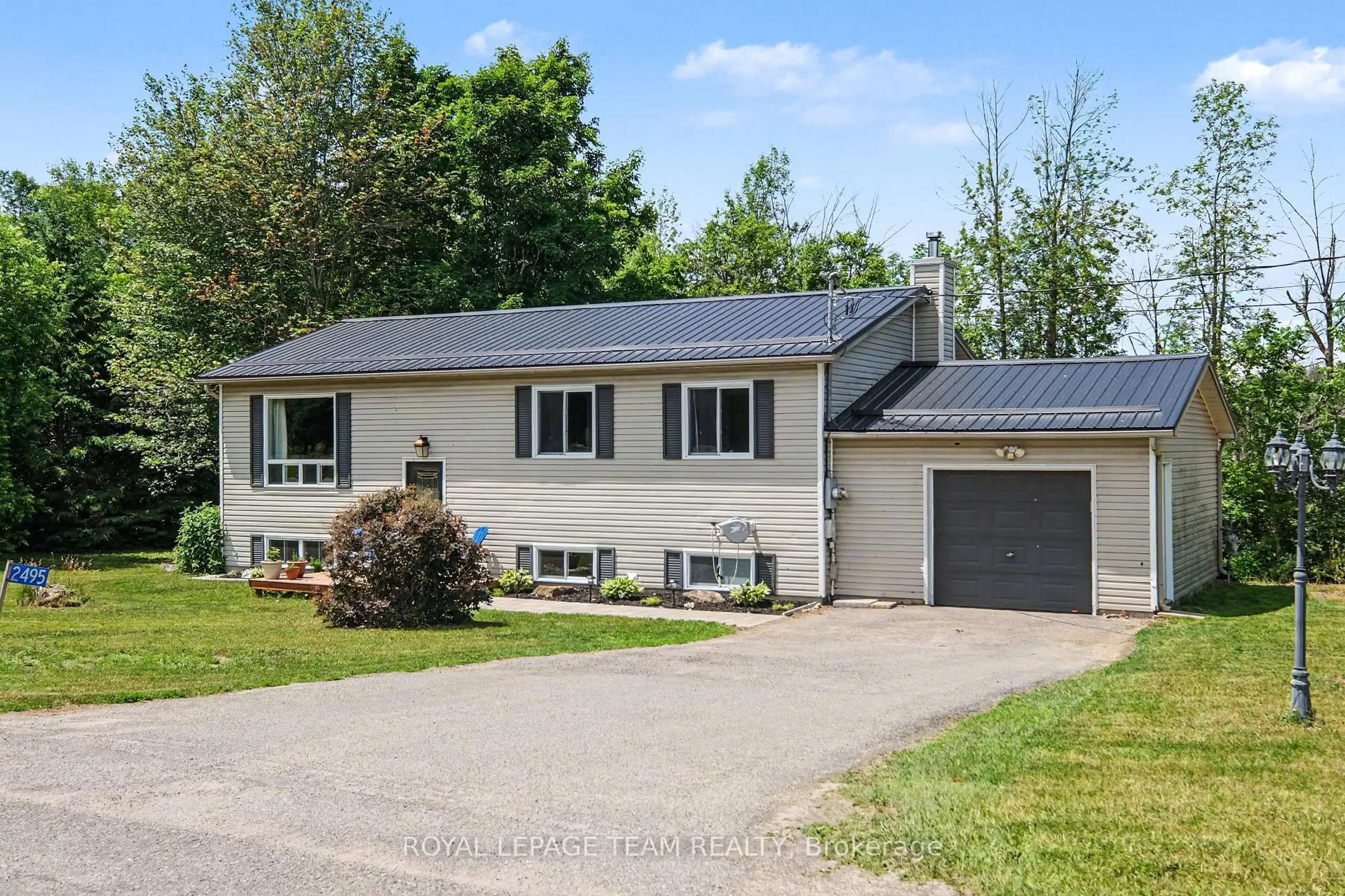 Home with vinyl exterior material, street for 2495 River Rd, North Grenville Ontario K0G 1J0