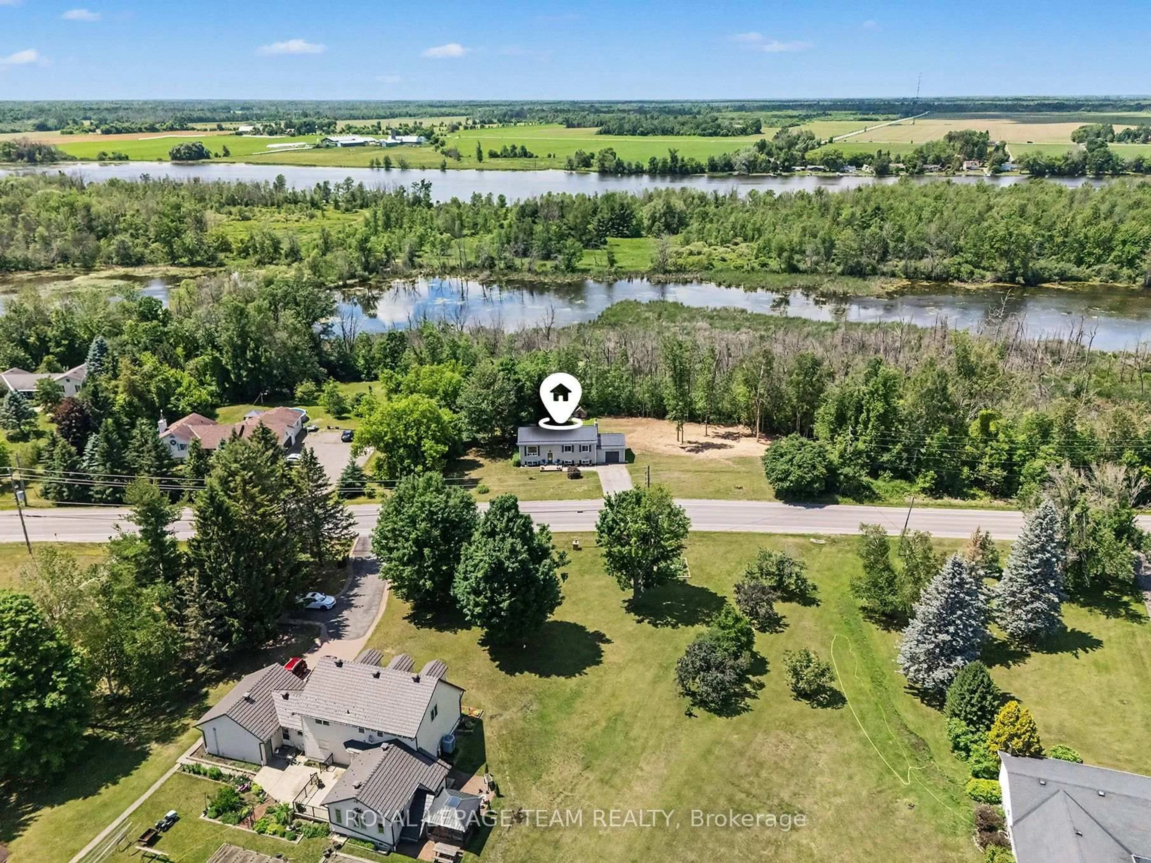 A pic from outside/outdoor area/front of a property/back of a property/a pic from drone, water/lake/river/ocean view for 2495 River Rd, North Grenville Ontario K0G 1J0